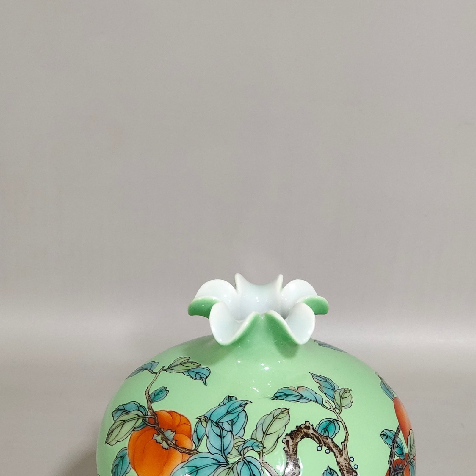 Qing Dynasty Yongzheng A green-glazed apple persimmon and pomegranate statue