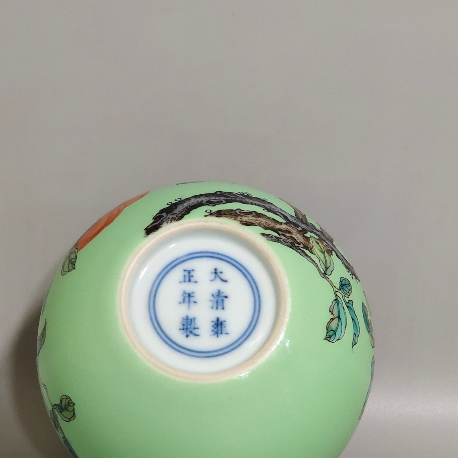 Qing Dynasty Yongzheng A green-glazed apple persimmon and pomegranate statue