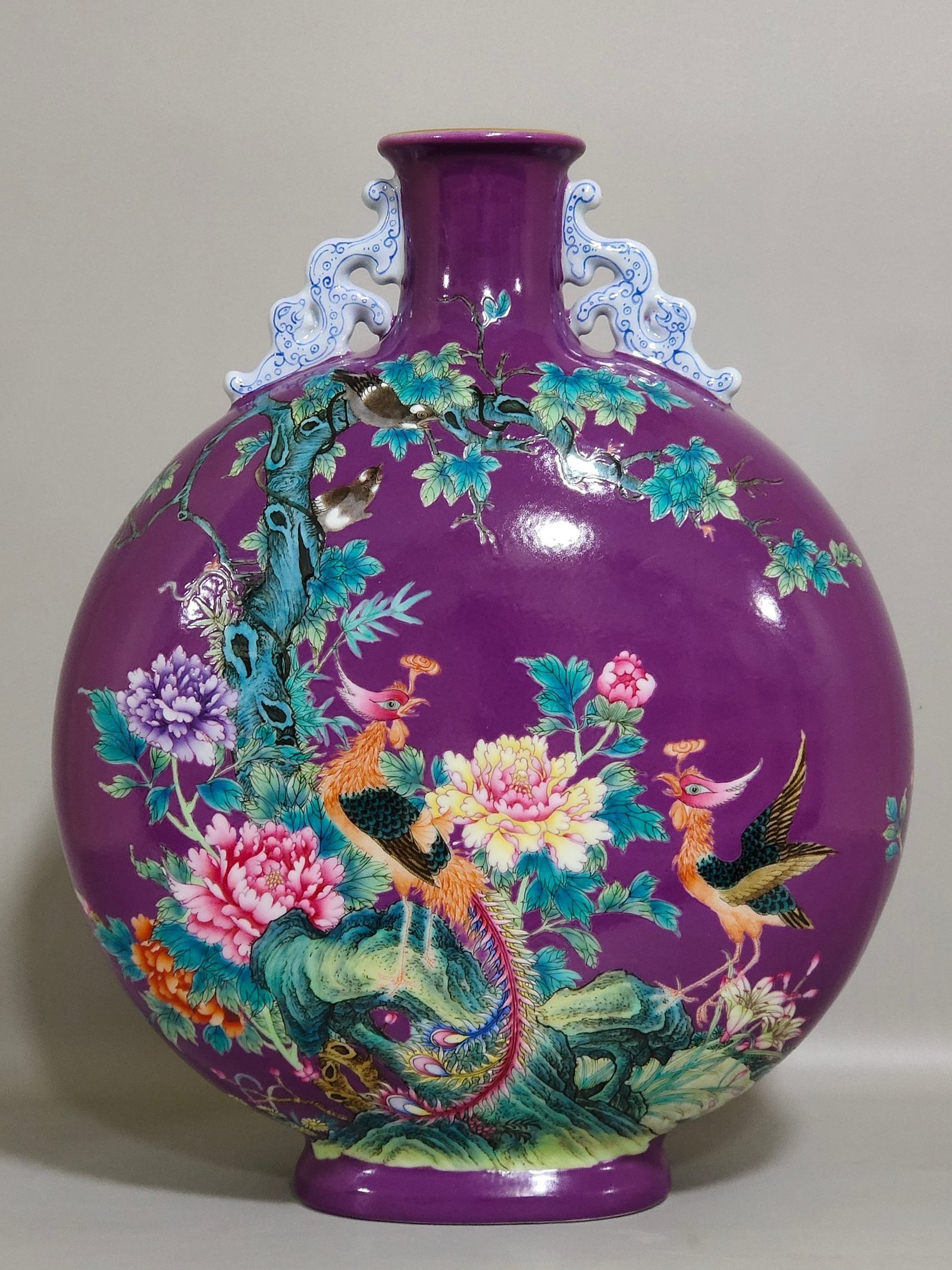 Qing Dynasty Yongzheng eggplant skin purple glaze Phoenix peony flower holding moon vase