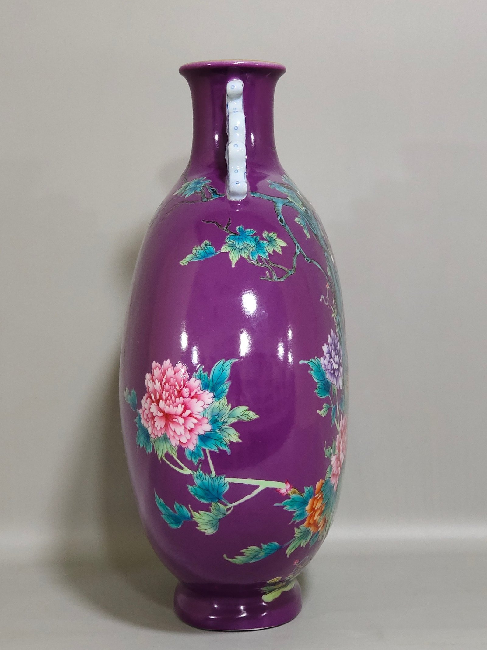 Qing Dynasty Yongzheng eggplant skin purple glaze Phoenix peony flower holding moon vase