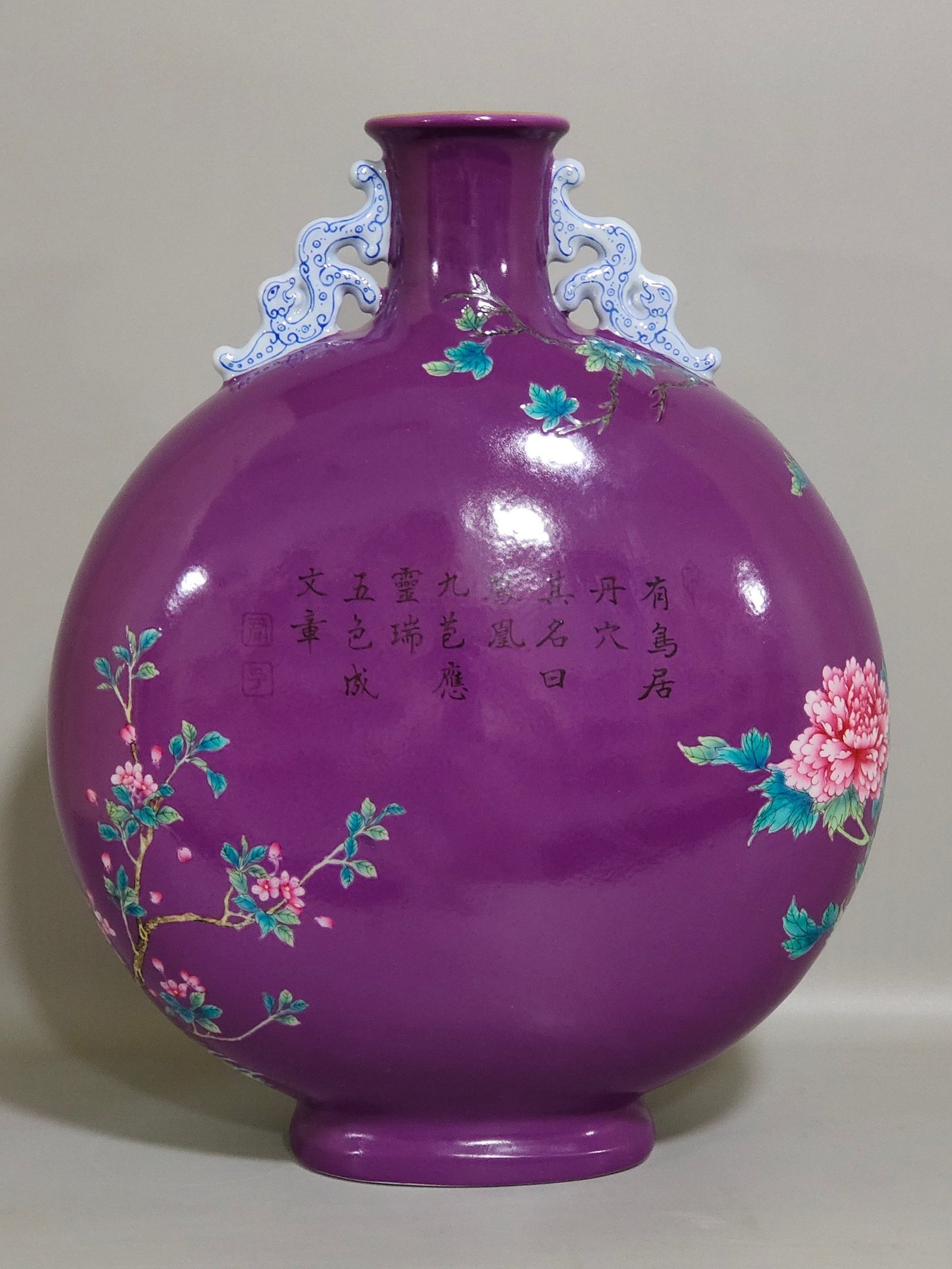 Qing Dynasty Yongzheng eggplant skin purple glaze Phoenix peony flower holding moon vase