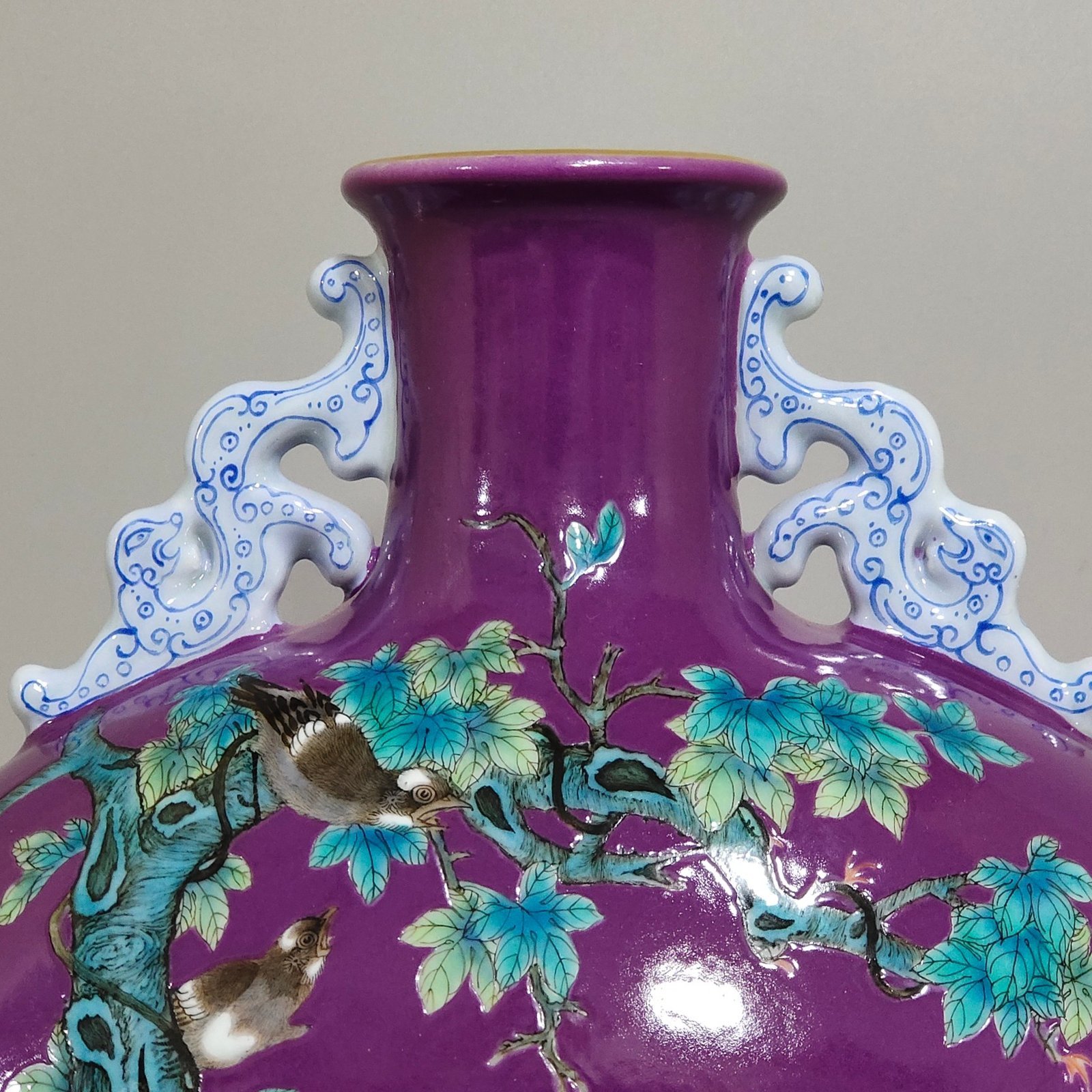 Qing Dynasty Yongzheng eggplant skin purple glaze Phoenix peony flower holding moon vase