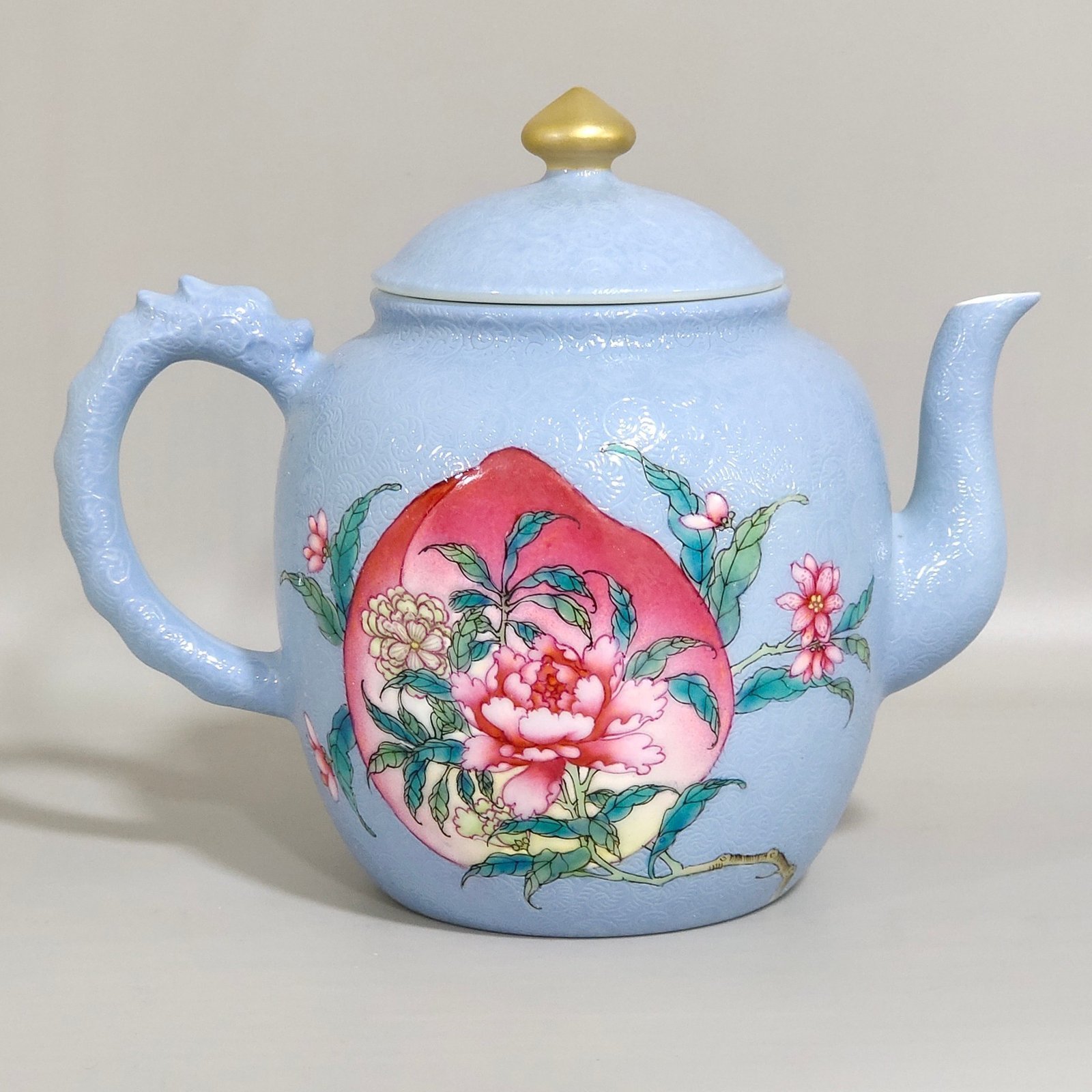 Qing Dynasty Yongzheng blue-glazed peach flower teapot