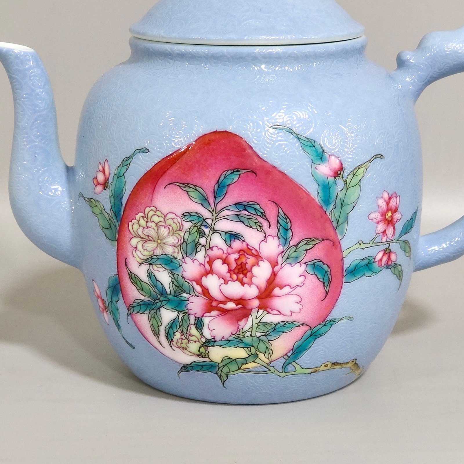 Qing Dynasty Yongzheng blue-glazed peach flower teapot