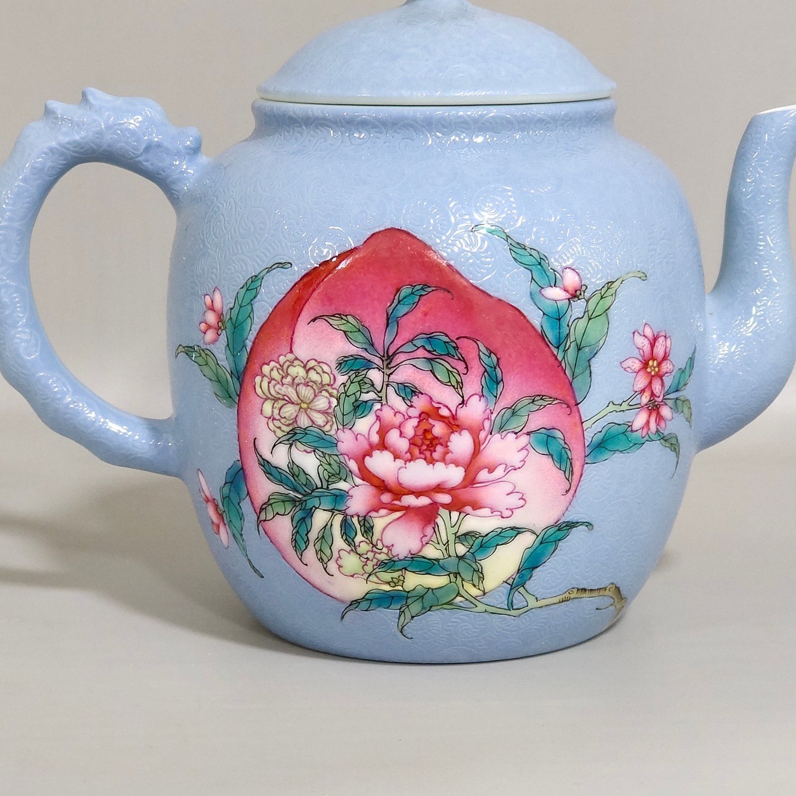 Qing Dynasty Yongzheng blue-glazed peach flower teapot