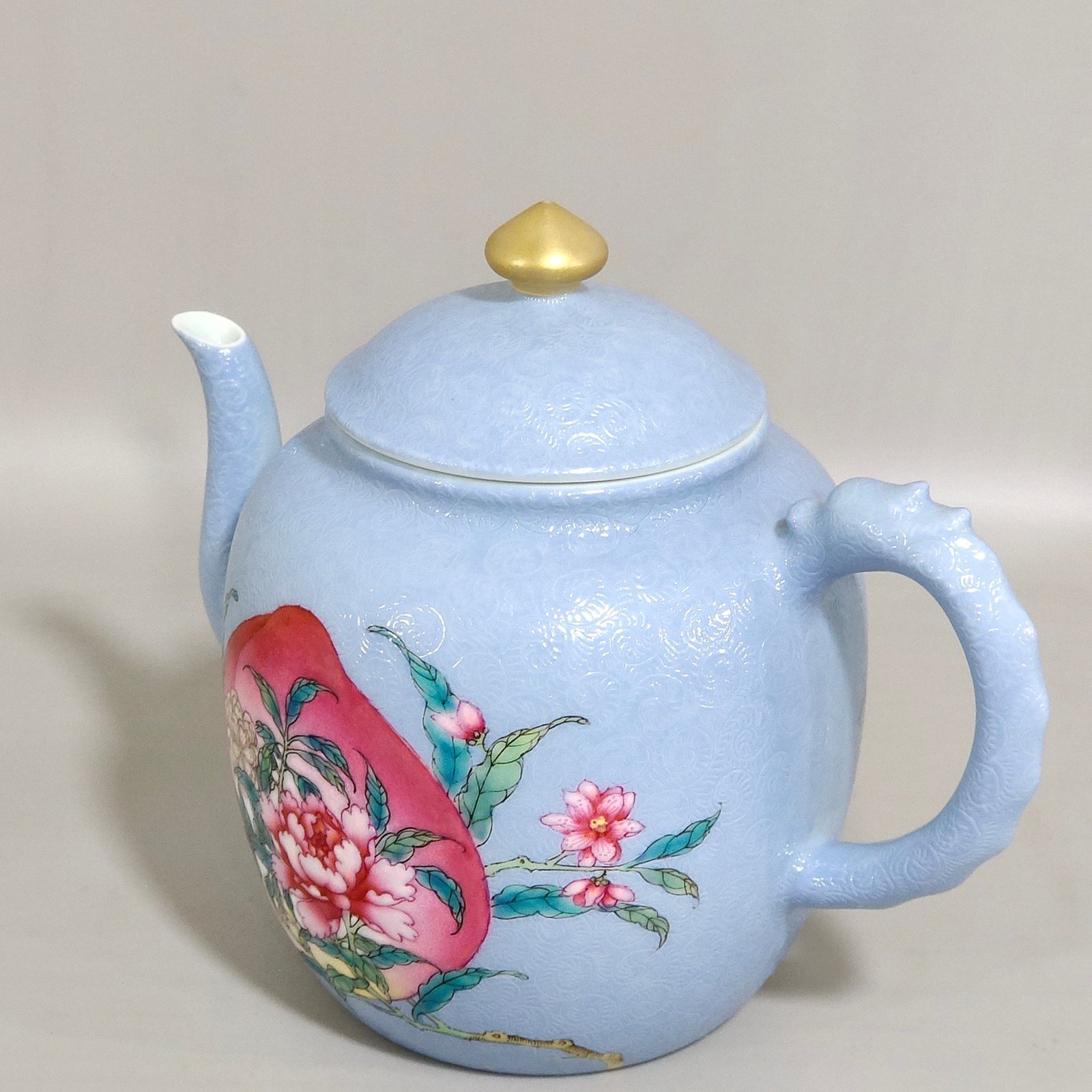 Qing Dynasty Yongzheng blue-glazed peach flower teapot