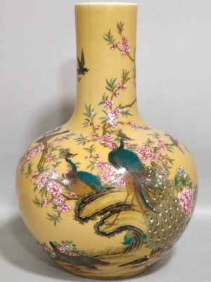 Qing Dynasty Yongzheng yellow-glazed peacock flower and bird celestial sphere vase