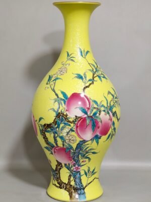 Qing Dynasty Yongzheng yellow glaze grilled eight peach olive vase