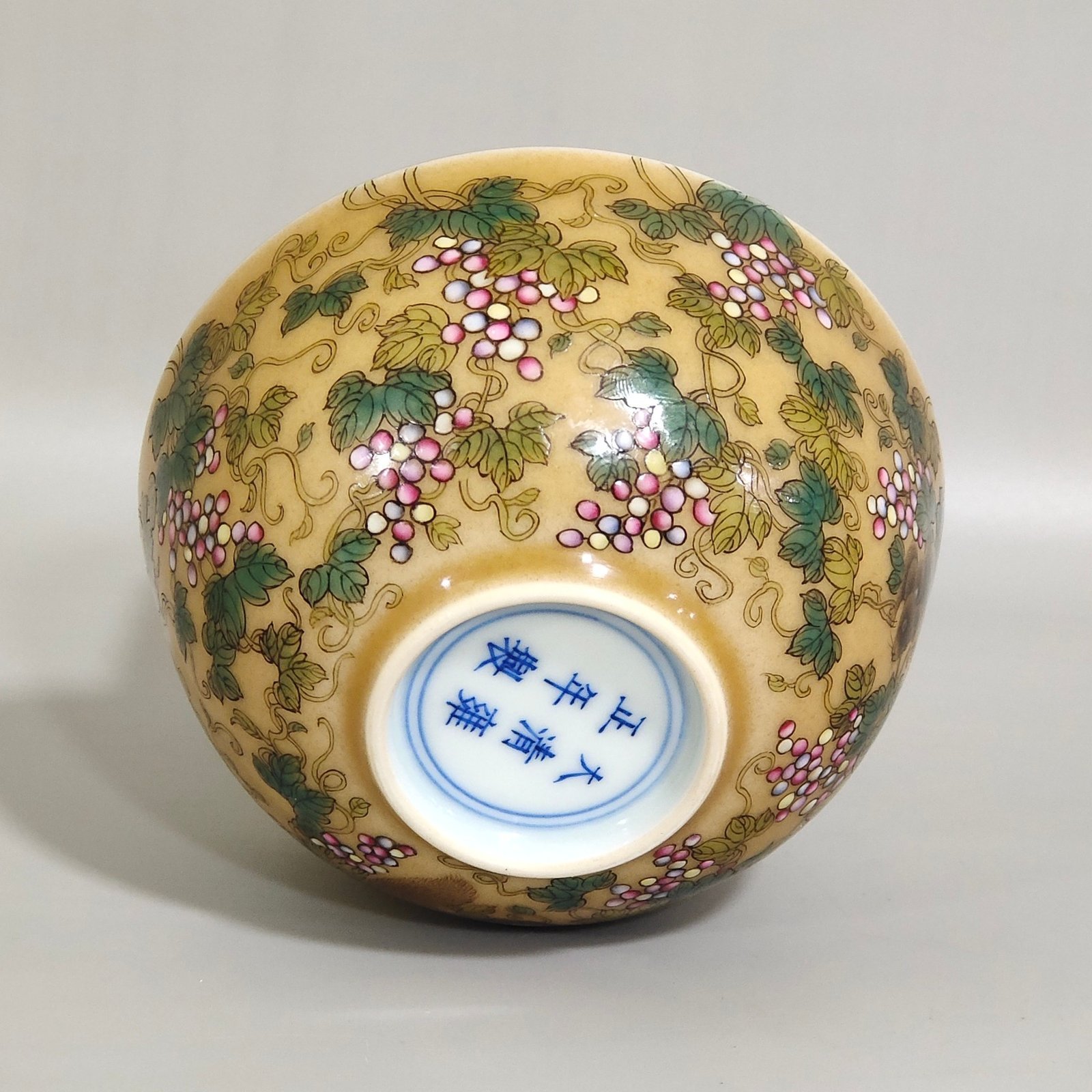 Qing Dynasty Yongzheng yellow-glazed squirrel grape cup