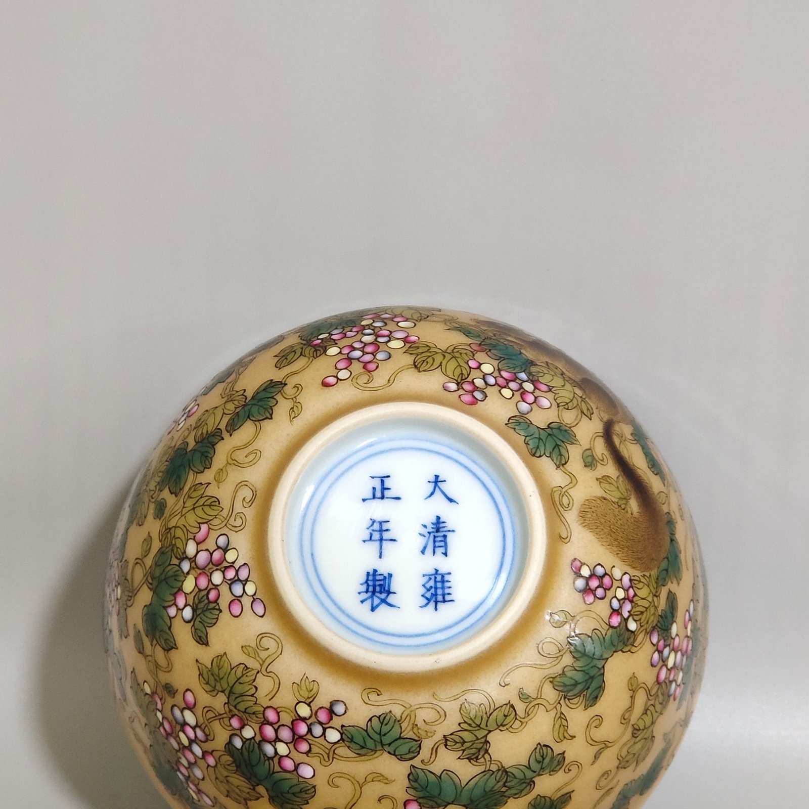 Qing Dynasty Yongzheng yellow-glazed squirrel grape cup