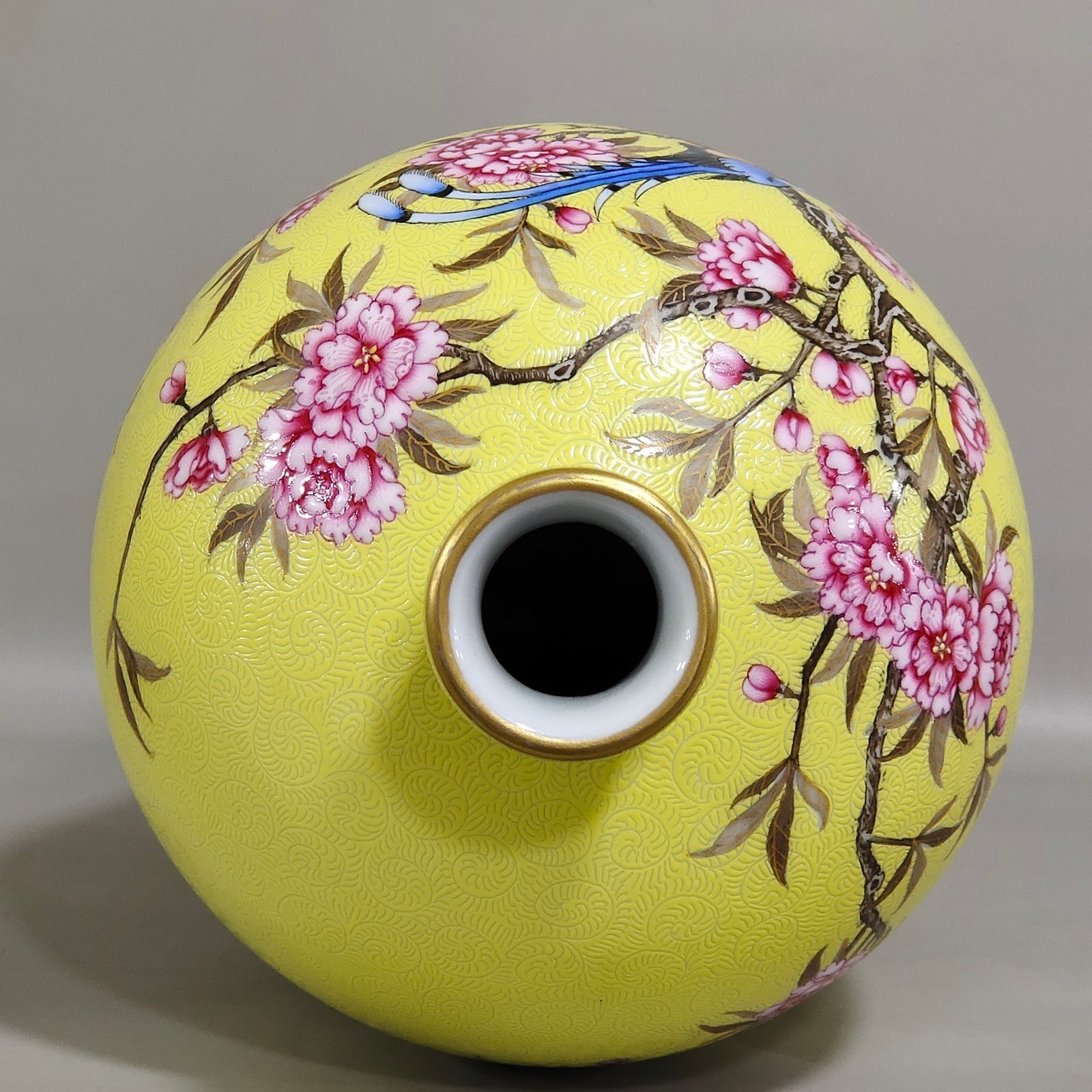 Qing Dynasty Yongzheng yellow glaze rolled plum vase with flowers and birds inscribed with poems