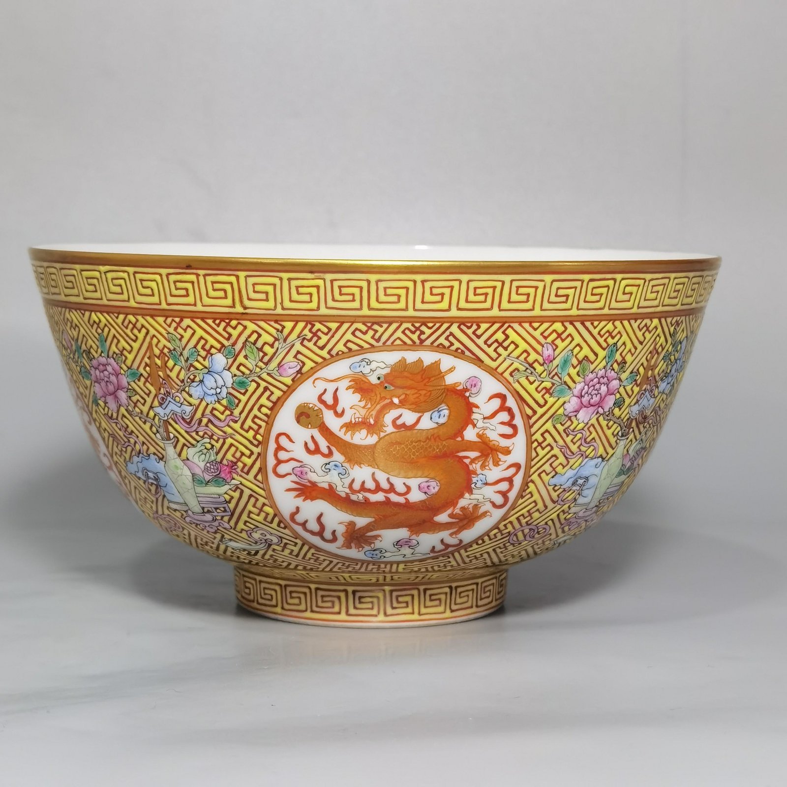 Qing Dynasty Guangxu A pair of yellow and pastel windowed dragon bowls