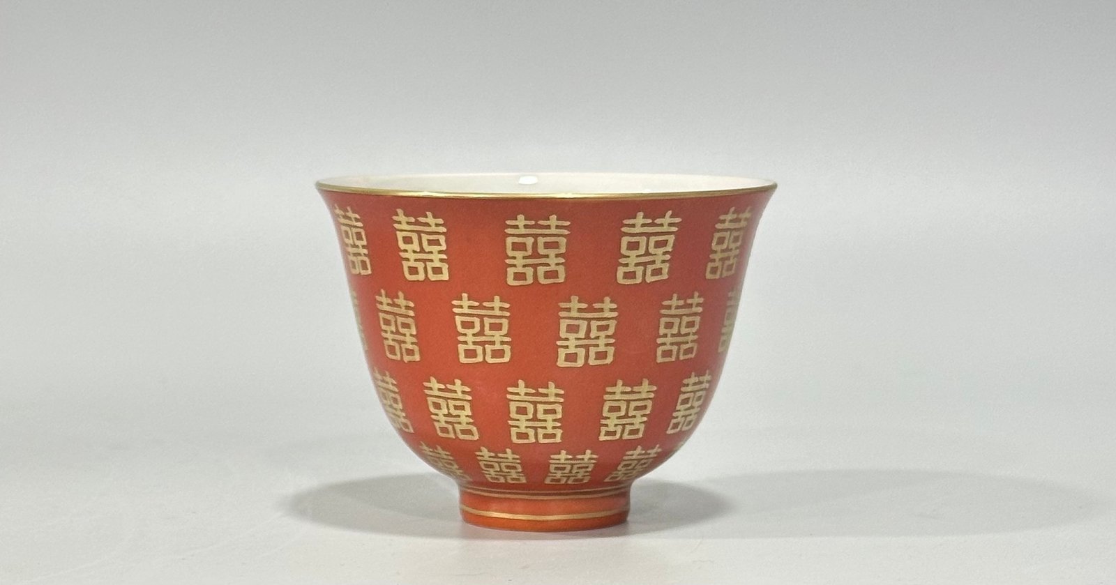 Qing Dynasty Tongzhi Pastel coral red cup with gold double happiness pattern
