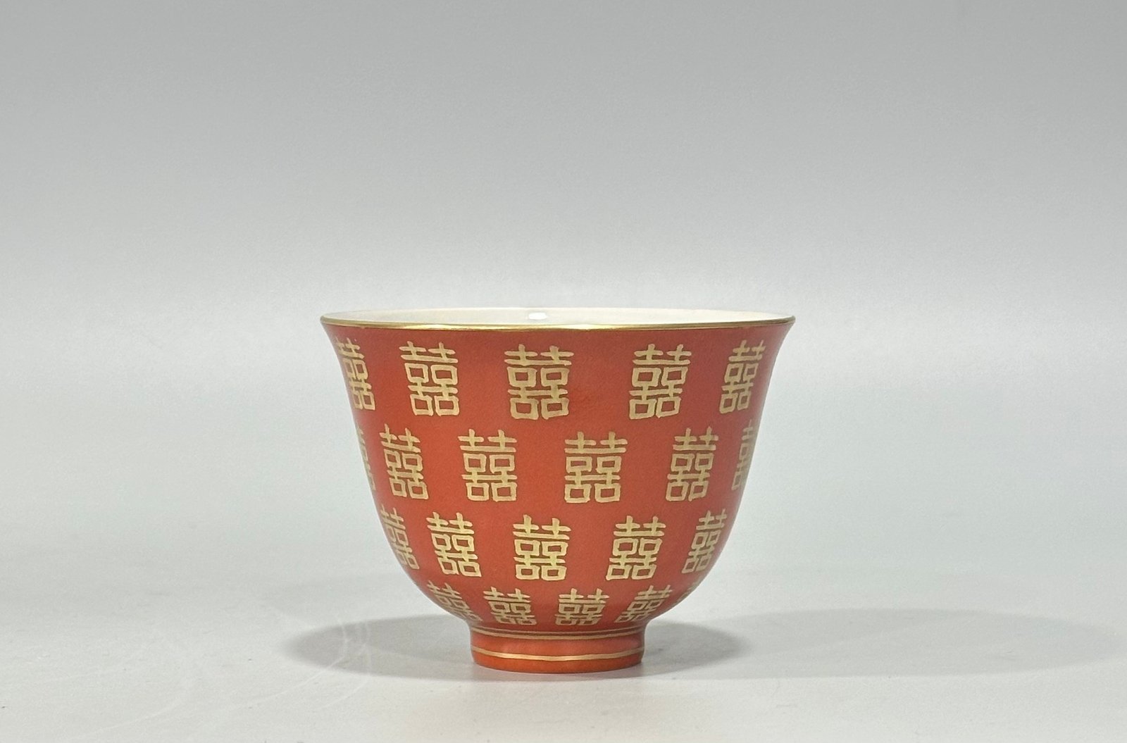 Qing Dynasty Tongzhi Pastel coral red cup with gold double happiness pattern
