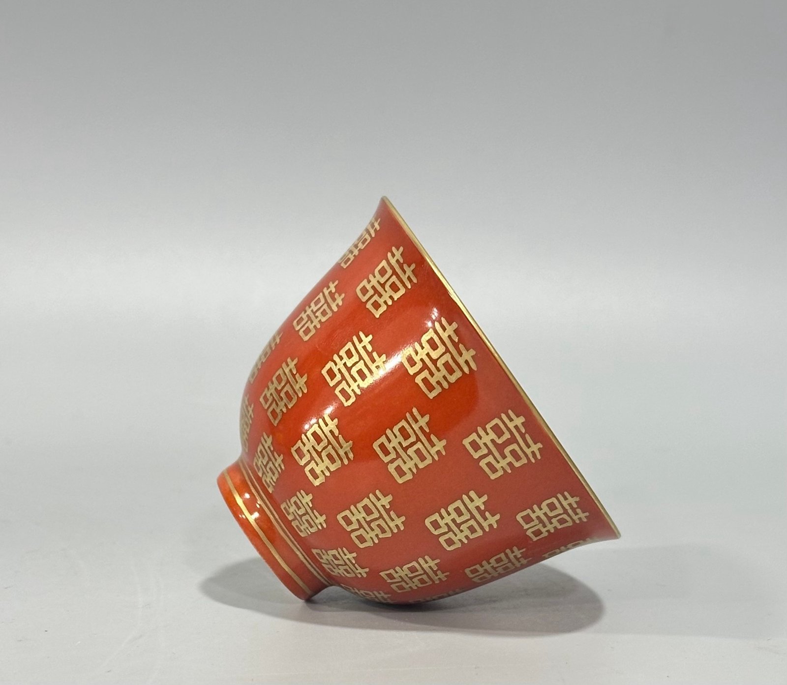 Qing Dynasty Tongzhi Pastel coral red cup with gold double happiness pattern