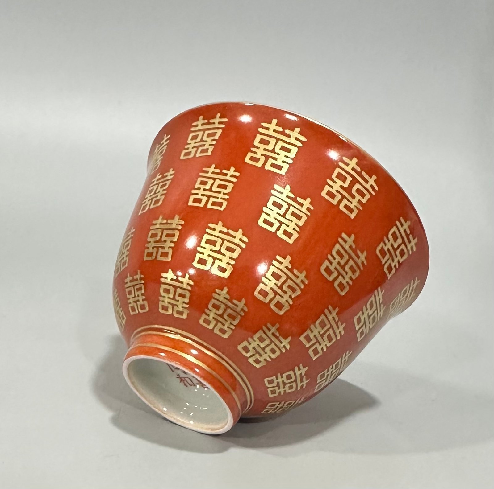 Qing Dynasty Tongzhi Pastel coral red cup with gold double happiness pattern