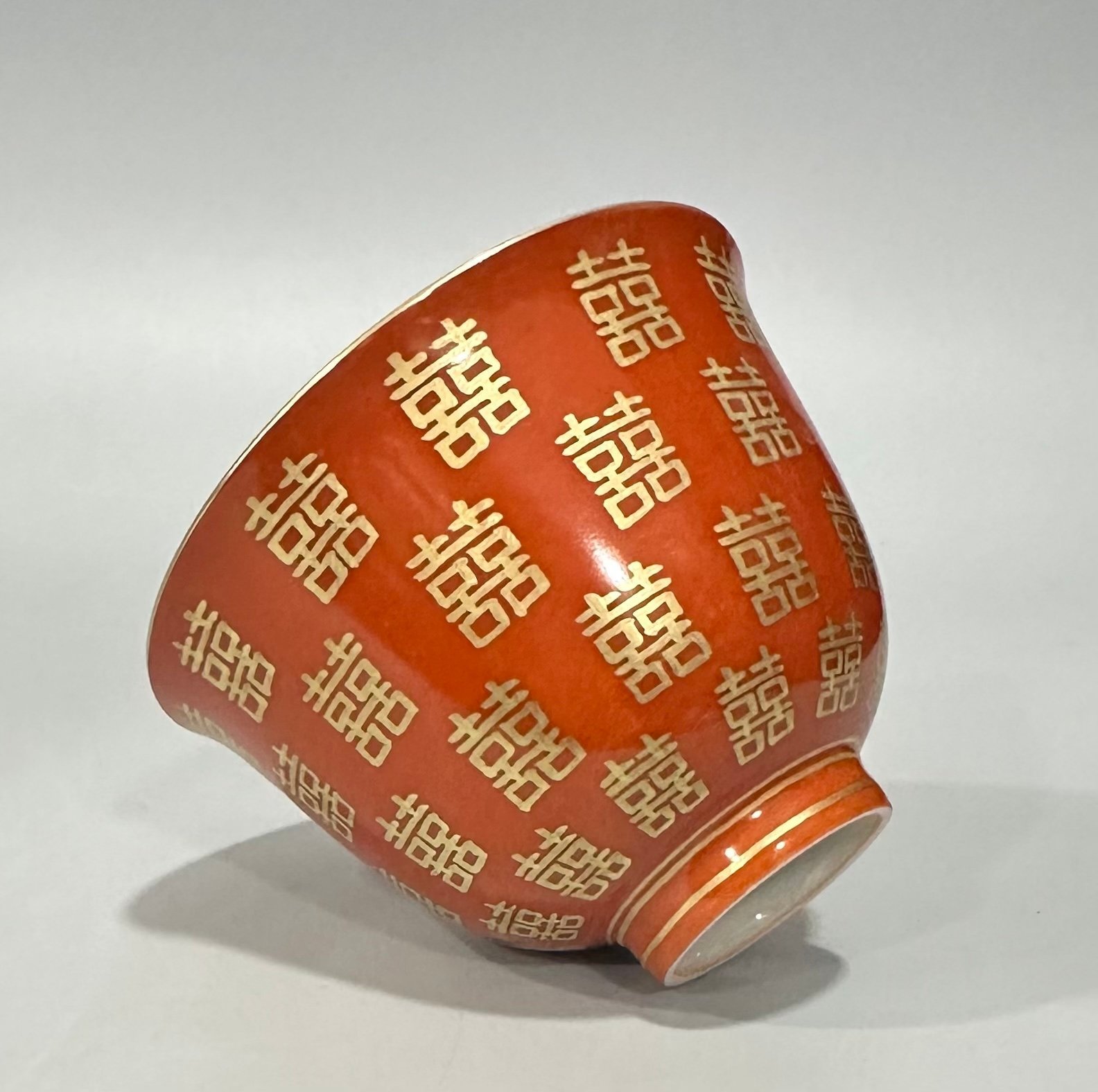 Qing Dynasty Tongzhi Pastel coral red cup with gold double happiness pattern