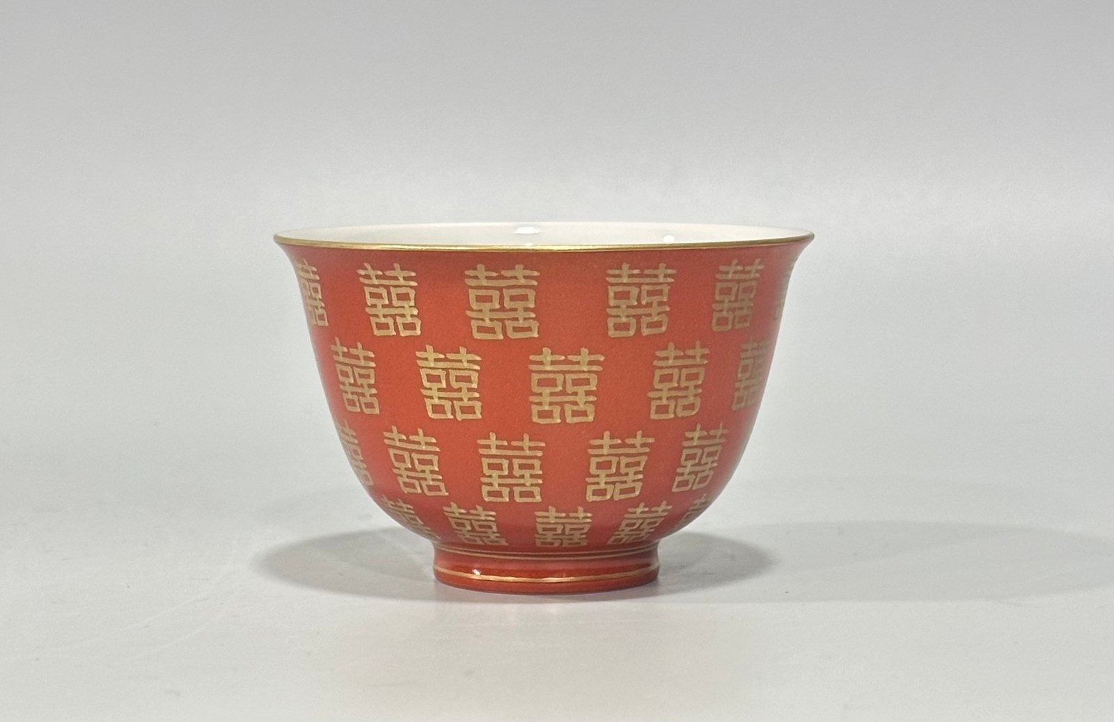 Qing Dynasty Tongzhi Pastel coral red cup with gold double happiness pattern