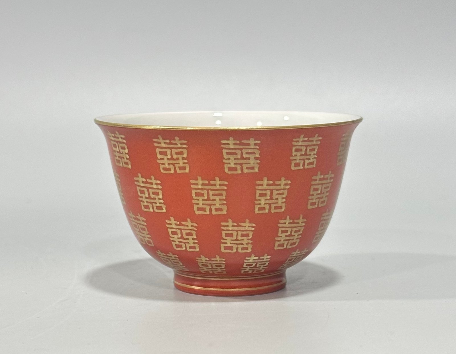 Qing Dynasty Tongzhi Pastel coral red cup with gold double happiness pattern