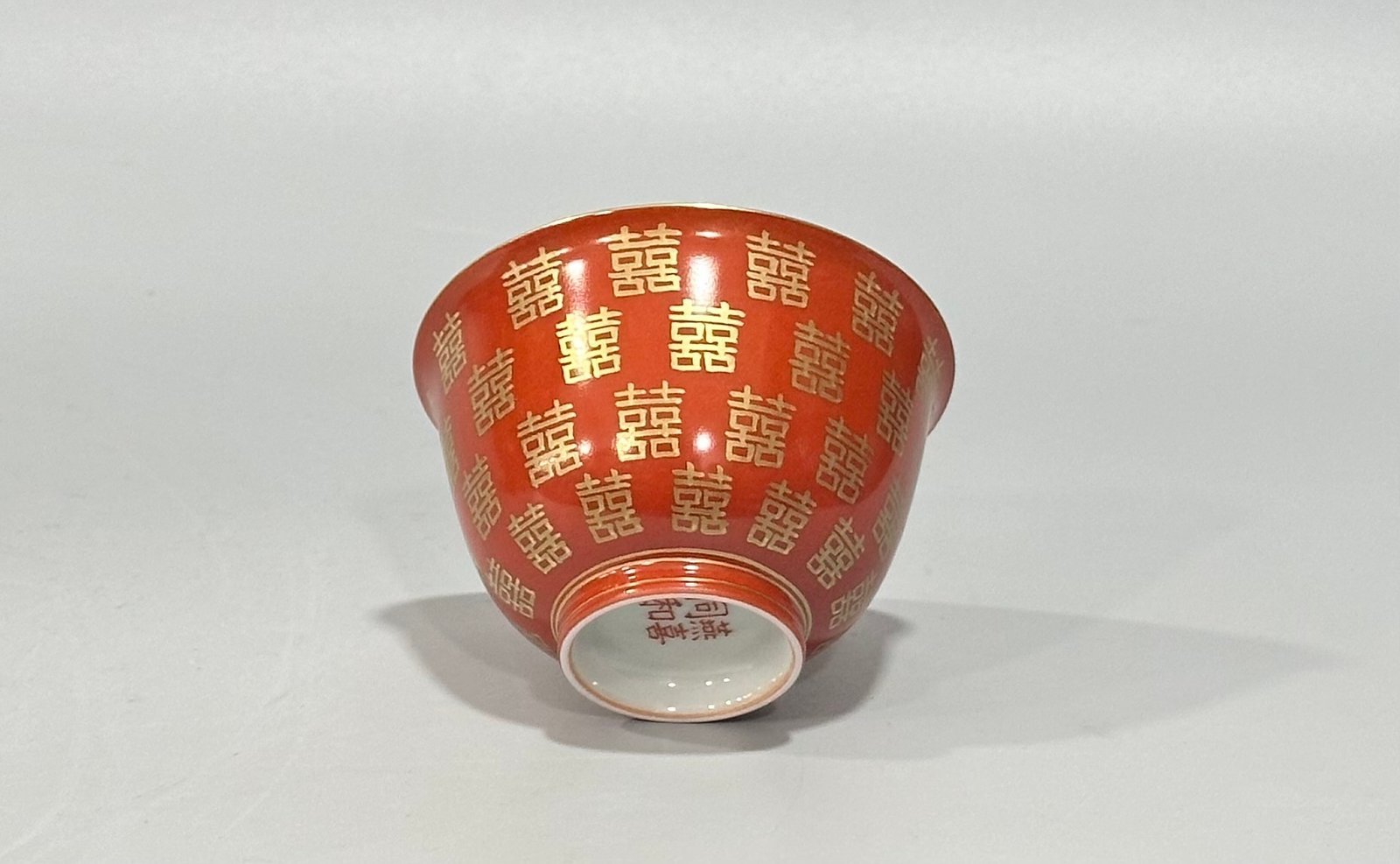 Qing Dynasty Tongzhi Pastel coral red cup with gold double happiness pattern