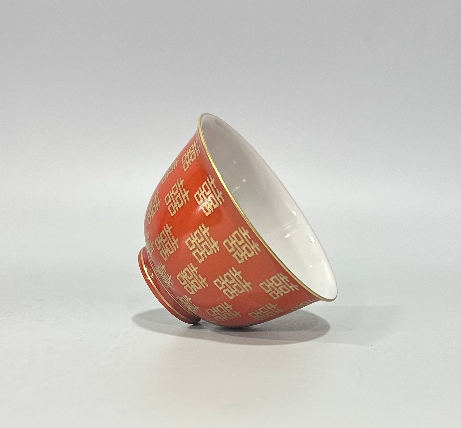 Qing Dynasty Tongzhi Pastel coral red cup with gold double happiness pattern