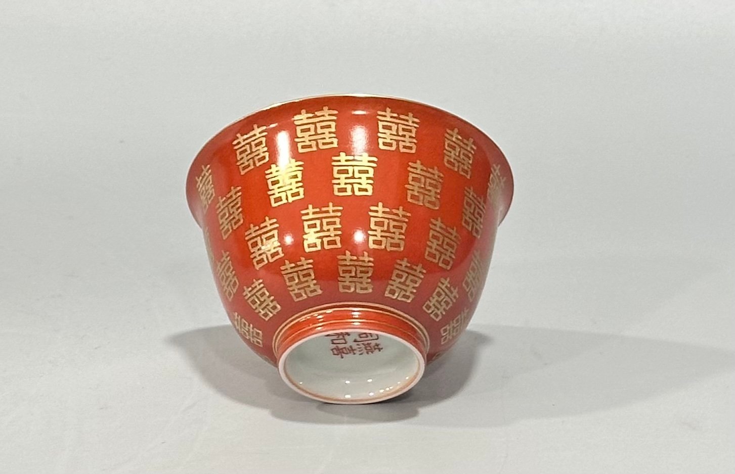 Qing Dynasty Tongzhi Pastel coral red cup with gold double happiness pattern