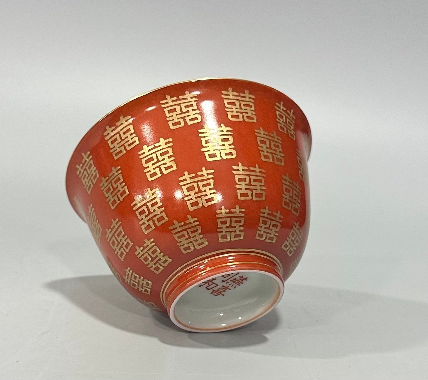 Qing Dynasty Tongzhi Pastel coral red cup with gold double happiness pattern