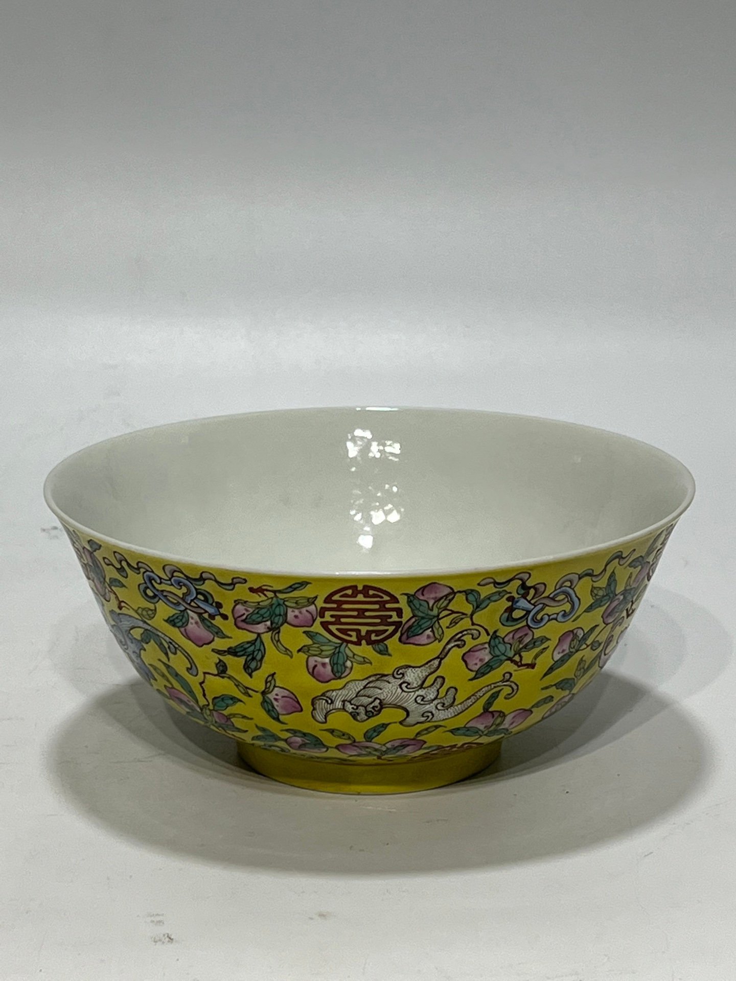 Qing Dynasty Tongzhi famille rose yellow ground longevity bowl