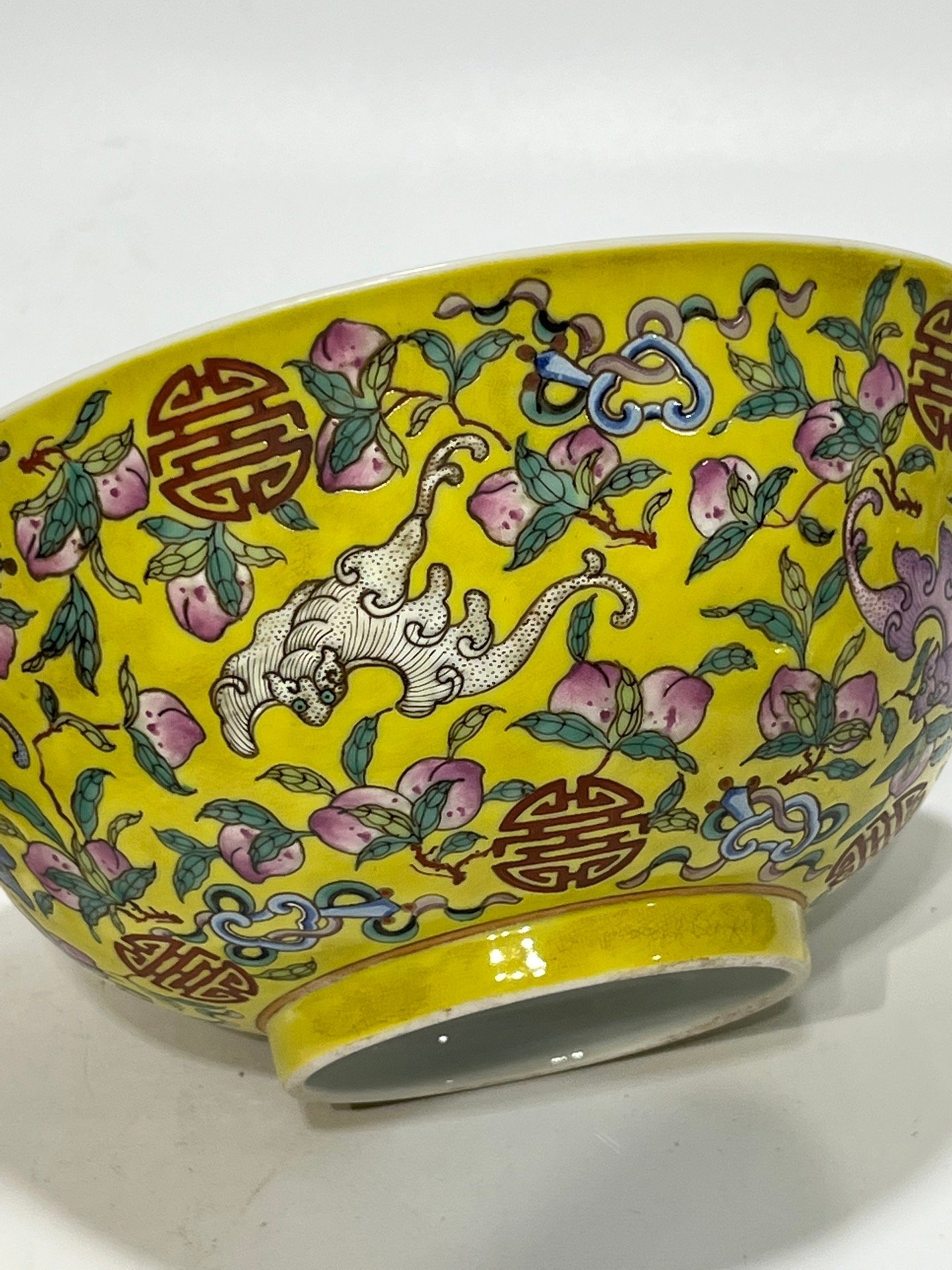 Qing Dynasty Tongzhi famille rose yellow ground longevity bowl