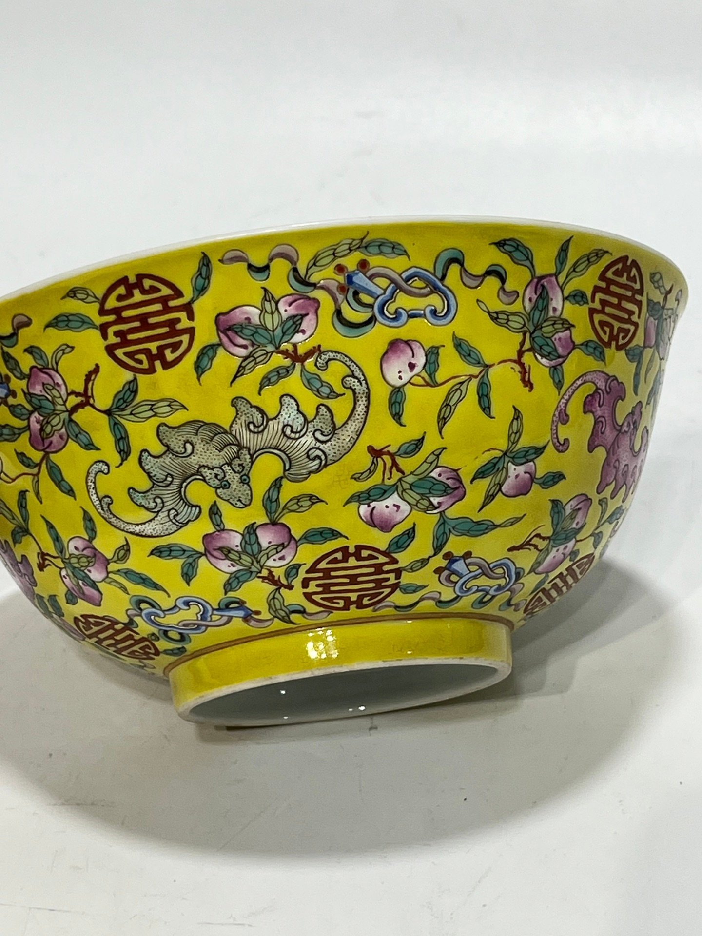Qing Dynasty Tongzhi famille rose yellow ground longevity bowl