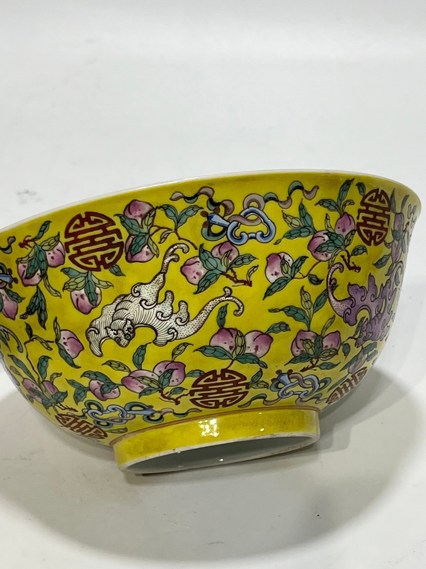 Qing Dynasty Tongzhi famille rose yellow ground longevity bowl