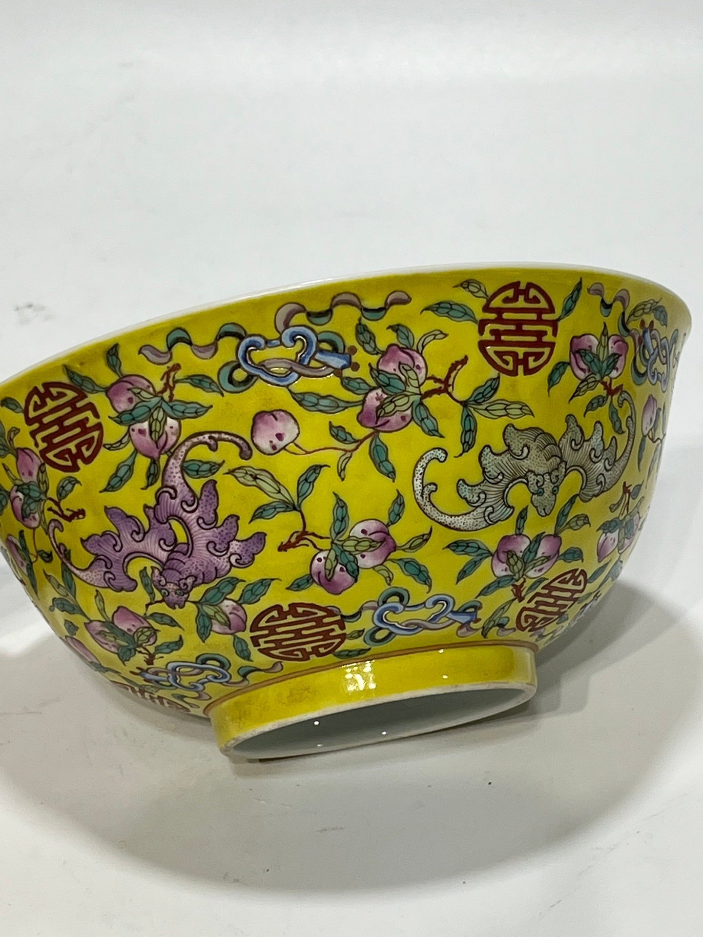 Qing Dynasty Tongzhi famille rose yellow ground longevity bowl