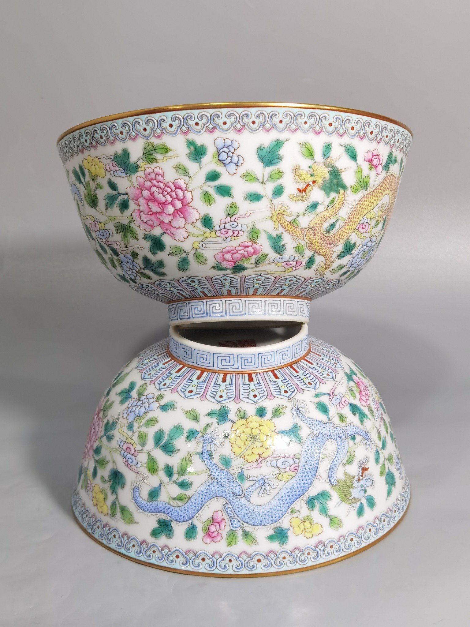 Qing Dynasty Jiaqing pastel double dragons wearing peony flower bowl