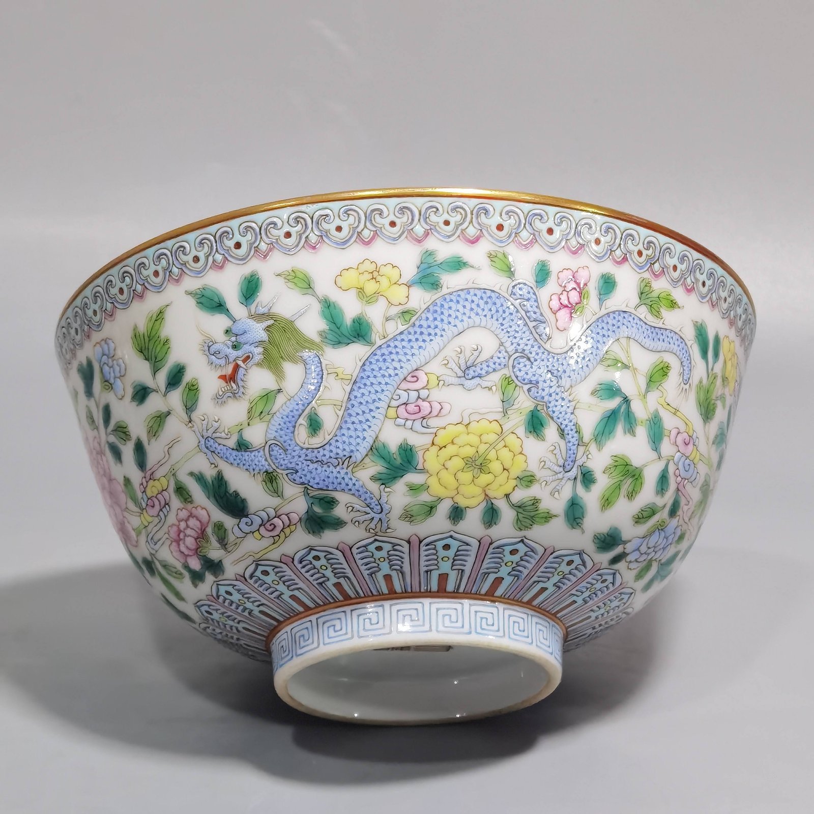 Qing Dynasty Jiaqing pastel double dragons wearing peony flower bowl