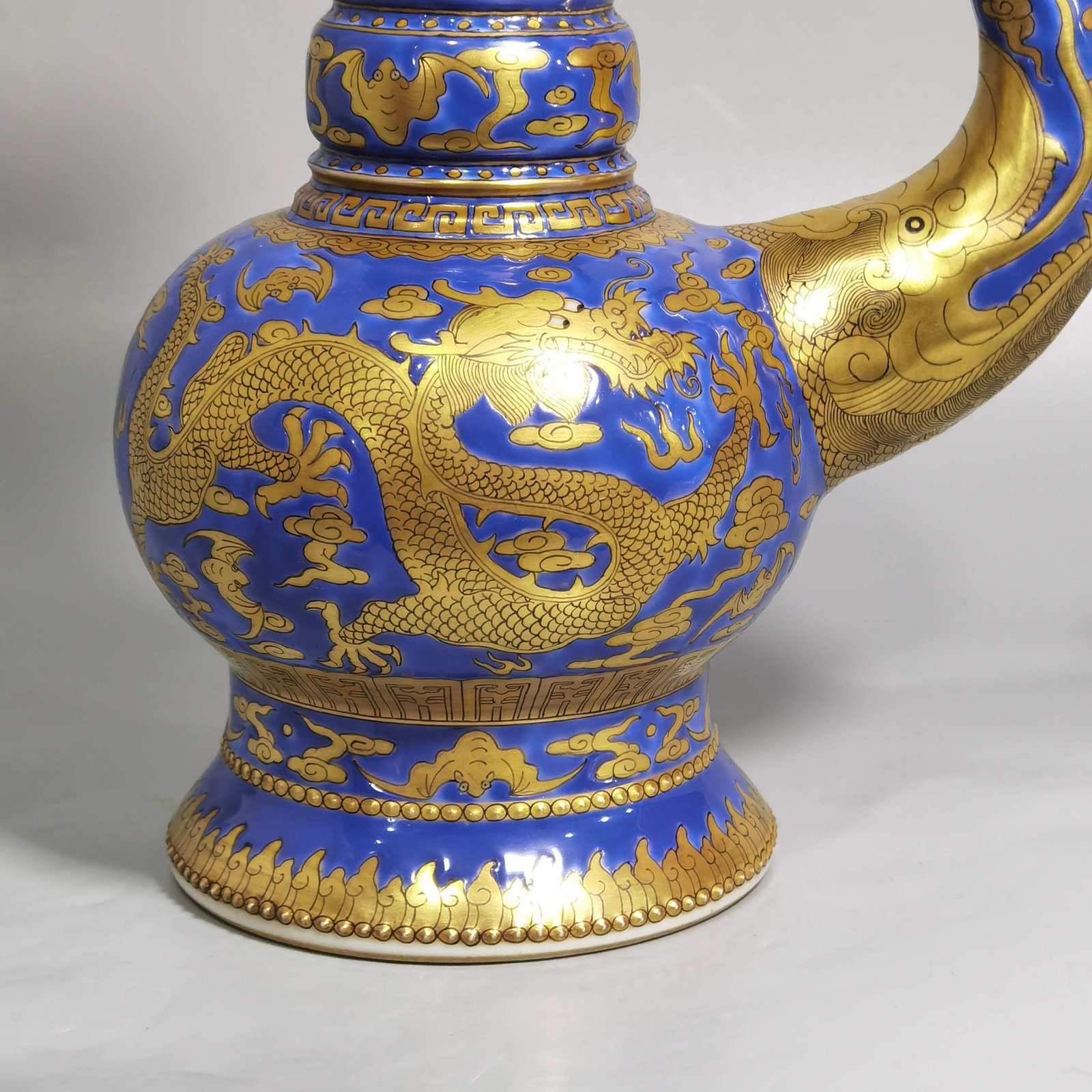 Qing Dynasty Jiaqing blue ground gold cloud and dragon pattern spray bottle