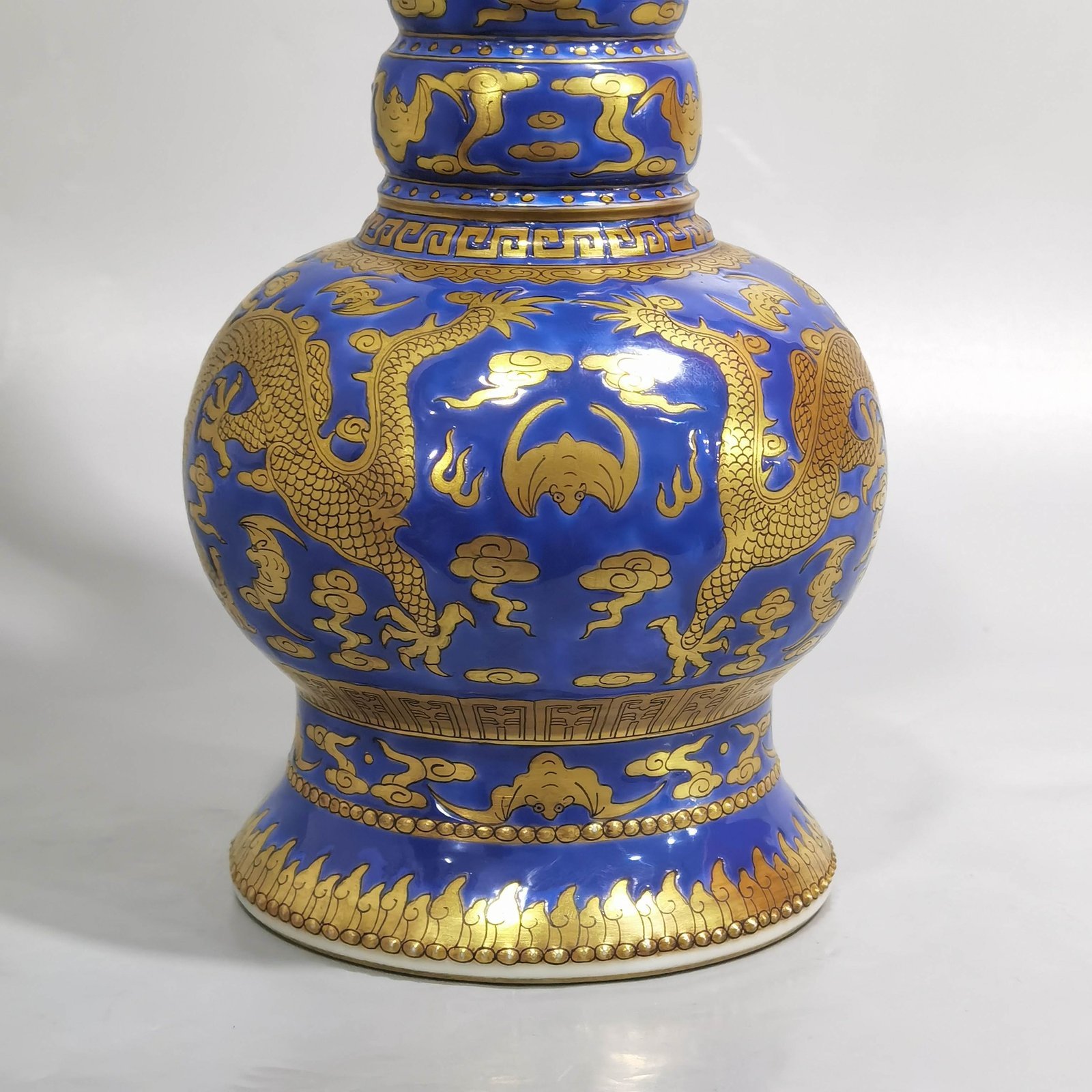 Qing Dynasty Jiaqing blue ground gold cloud and dragon pattern spray bottle