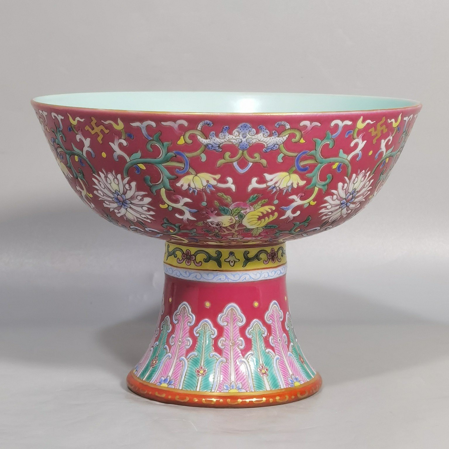 Qing Dynasty Jiaqing a rouge-red ground Fushou Twisting Lotus tall bowl