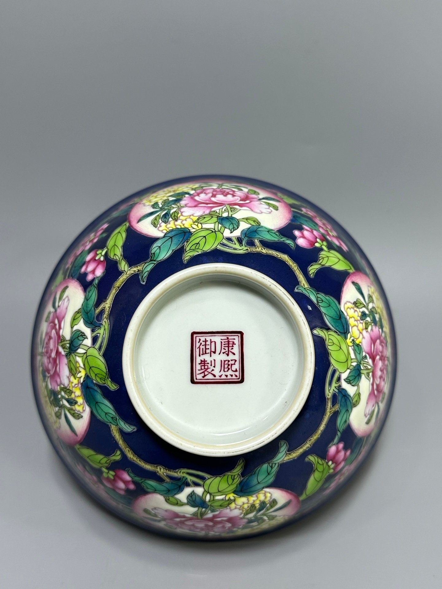 Qing Dynasty Kangxi year blue bowl with peach and flower pattern