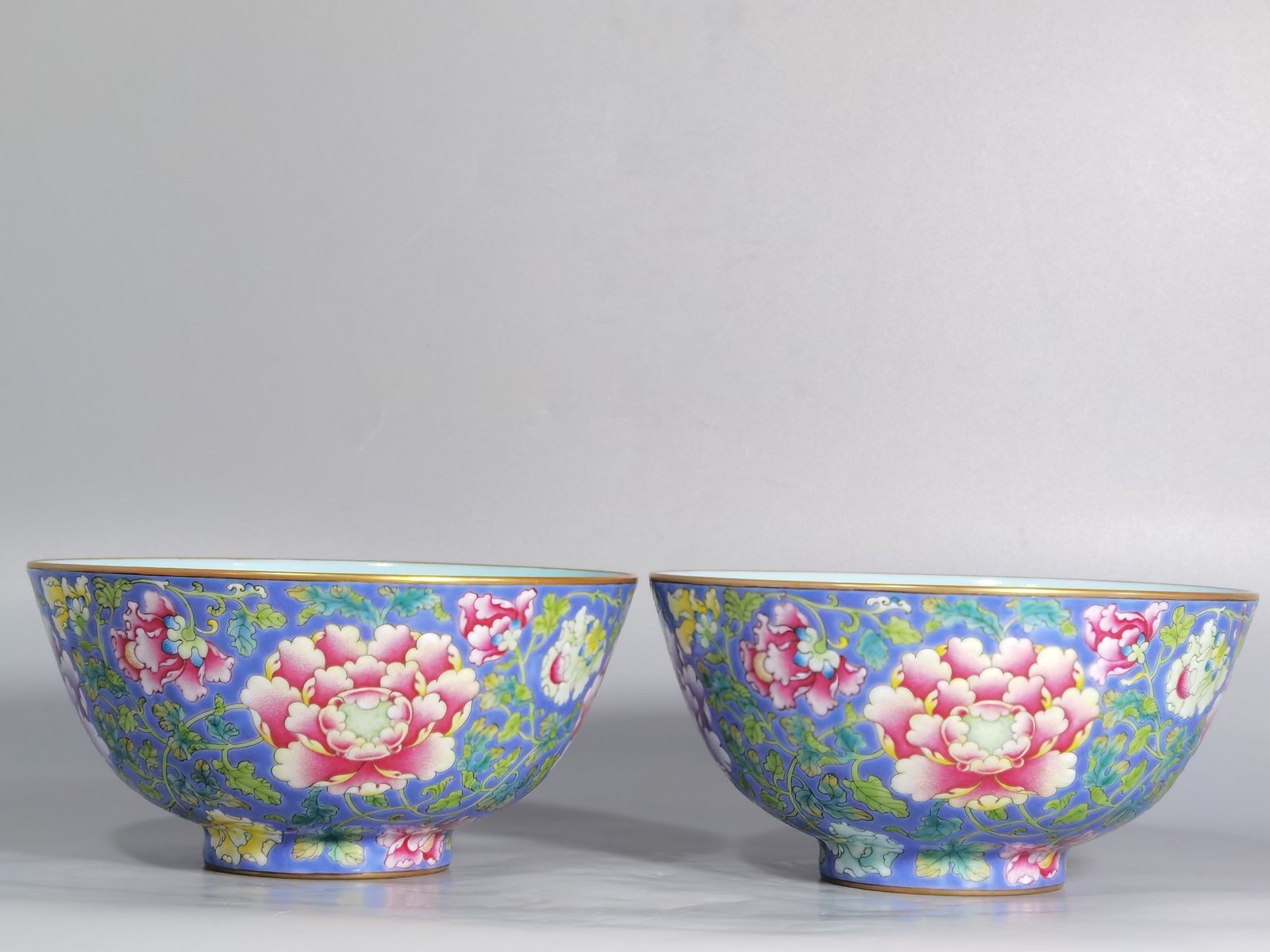 Qing Dynasty Kangxi imperial enamel blue ground lotus and peony flower bowl