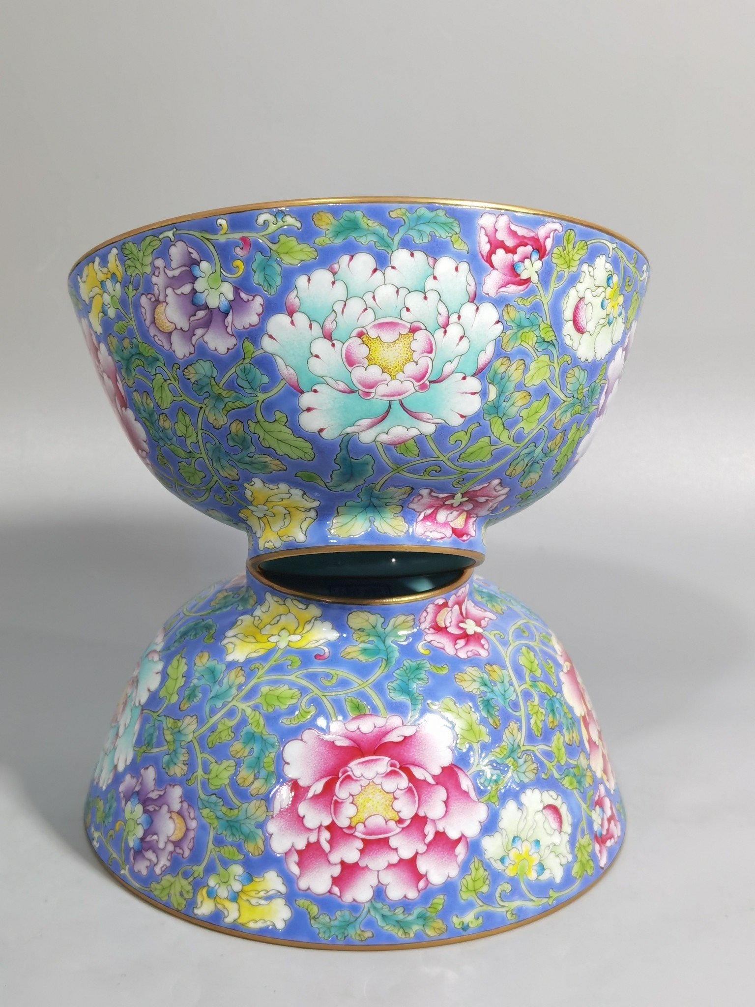 Qing Dynasty Kangxi imperial enamel blue ground lotus and peony flower bowl