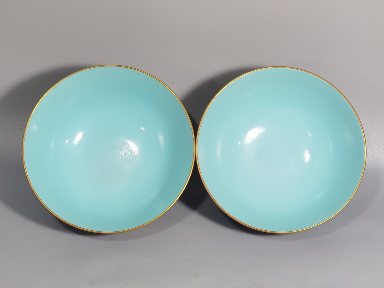 Qing Dynasty Kangxi imperial enamel blue ground lotus and peony flower bowl