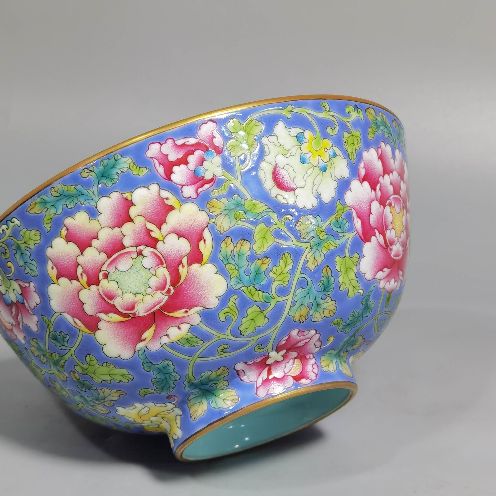 Qing Dynasty Kangxi imperial enamel blue ground lotus and peony flower bowl