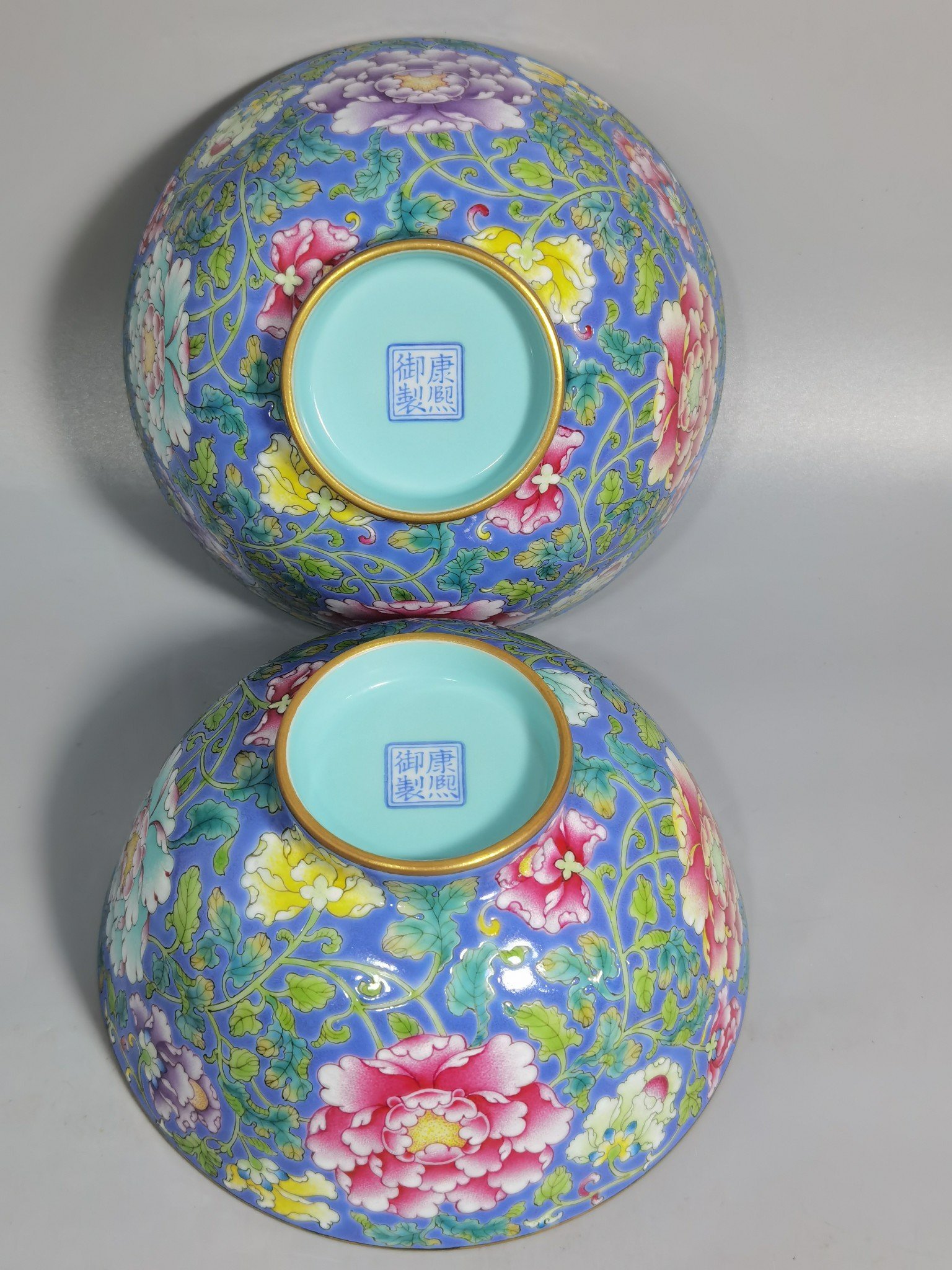 Qing Dynasty Kangxi imperial enamel blue ground lotus and peony flower bowl