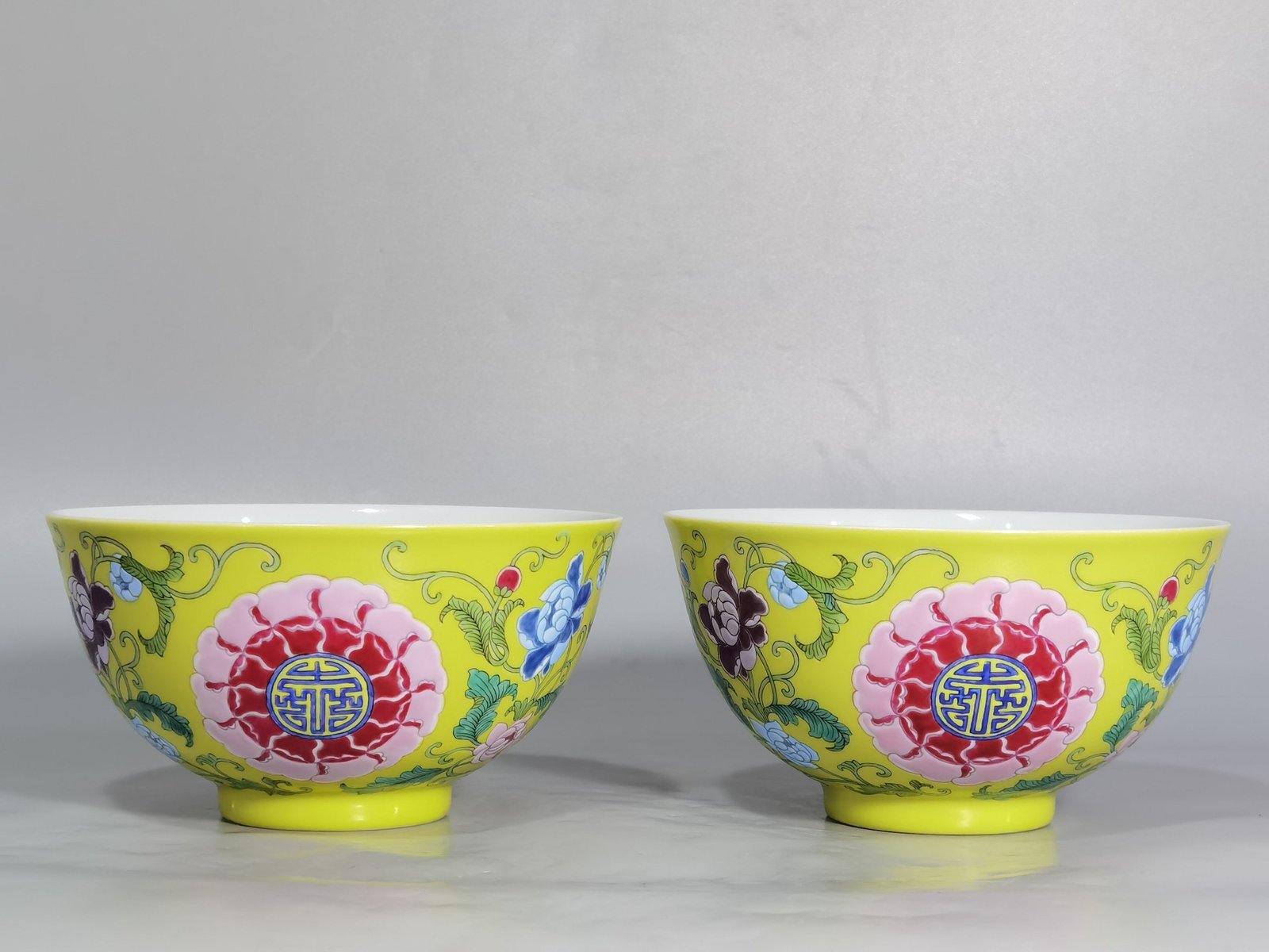 Qing Dynasty Kangxi Imperial enamel bowl with flowers and longevity characters on the ground