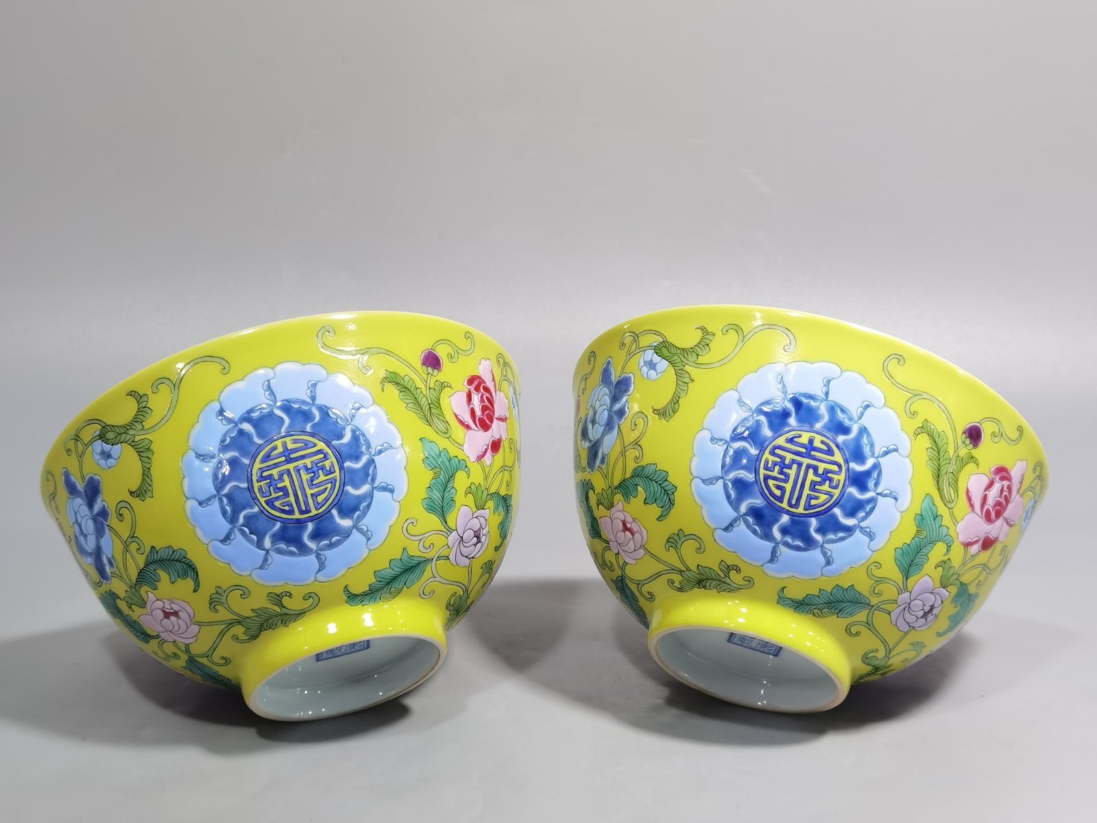 Qing Dynasty Kangxi Imperial enamel bowl with flowers and longevity characters on the ground