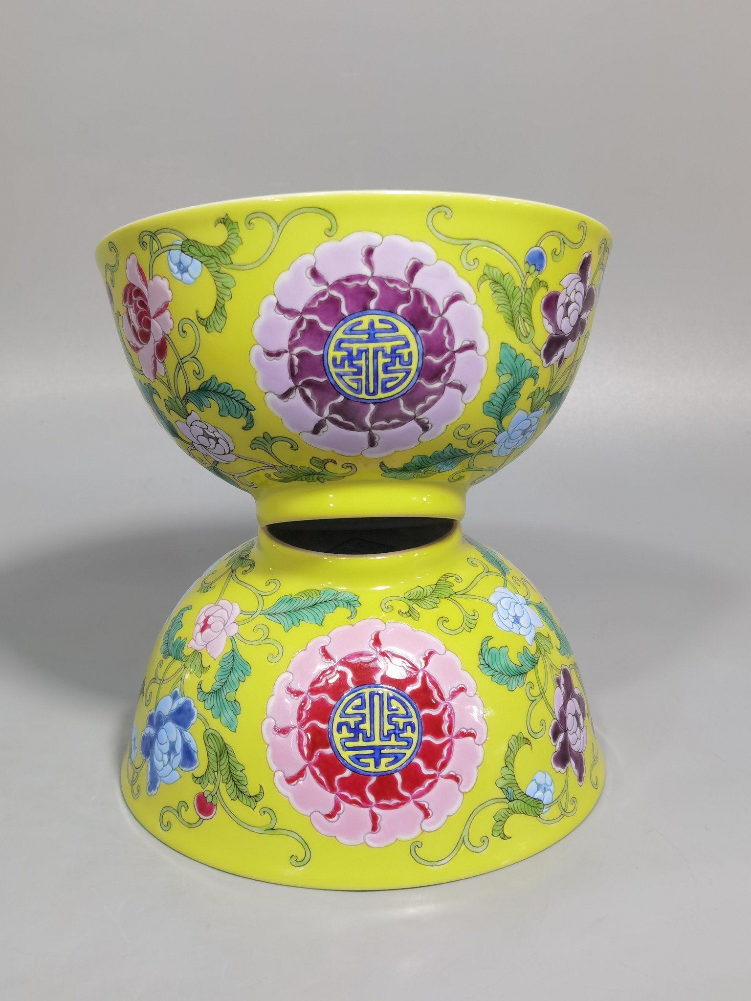 Qing Dynasty Kangxi Imperial enamel bowl with flowers and longevity characters on the ground