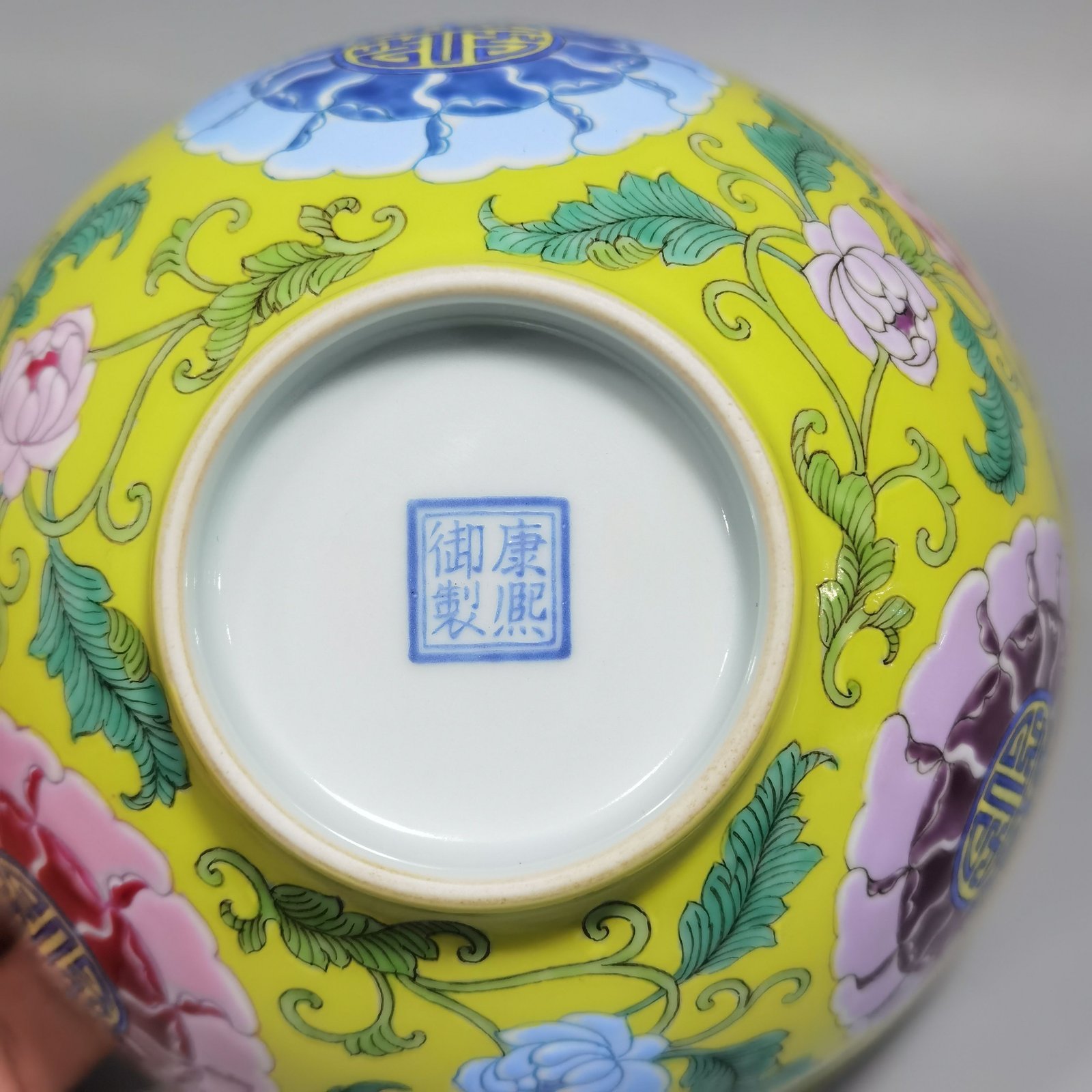Qing Dynasty Kangxi Imperial enamel bowl with flowers and longevity characters on the ground