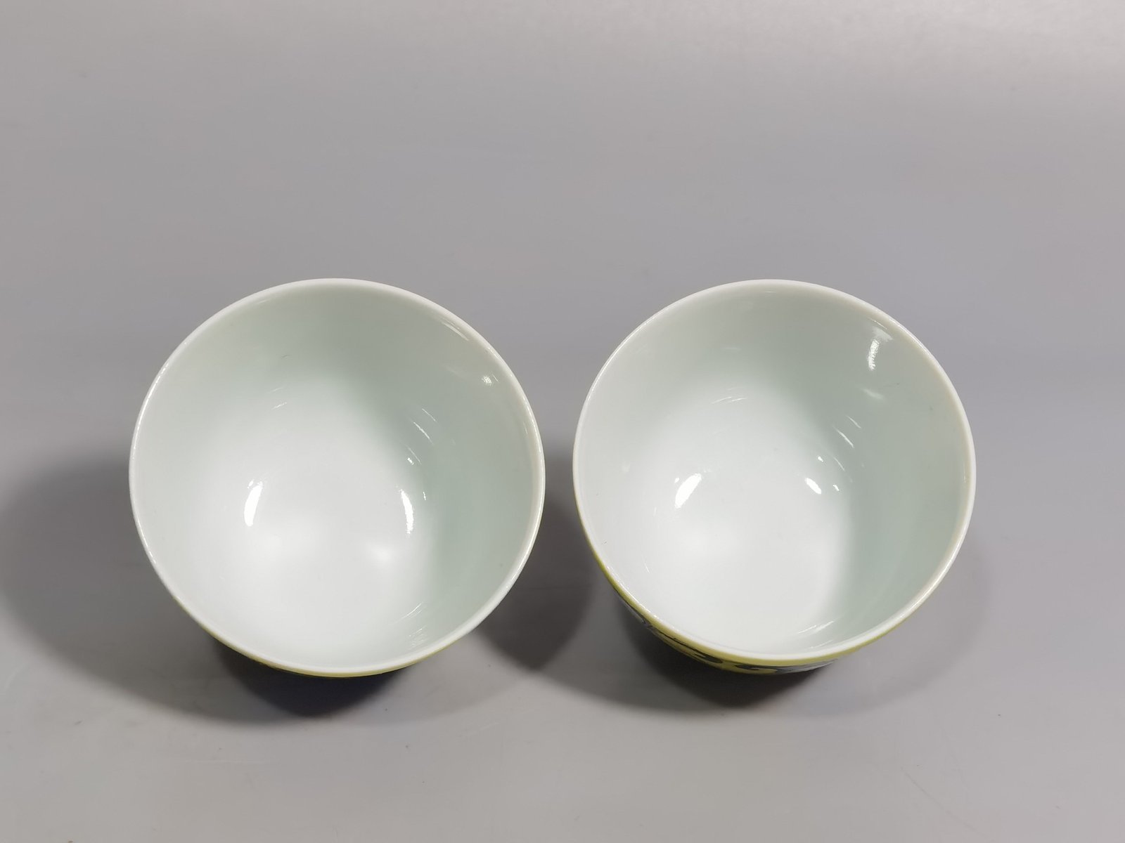 Qing Dynasty Kangxi pair of yellow enamel flower cups