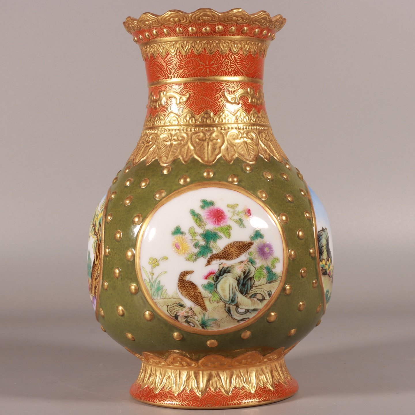 Qing Dynasty Qianlong enamel carving and gilt opening window with a Western figure inverted mouth bottle