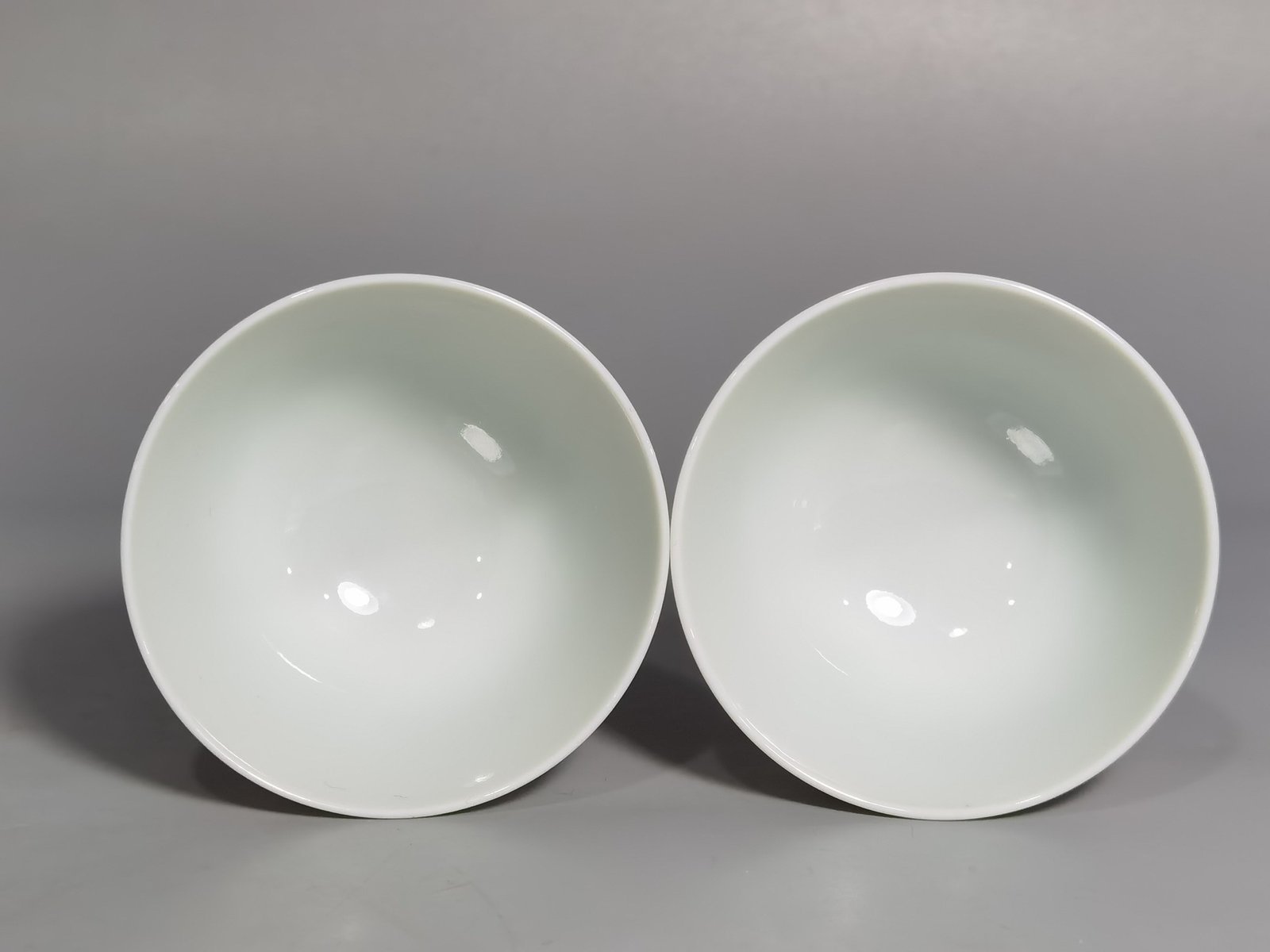 Qing Dynasty Yongzheng A pair of pastel mandarin duck and lotus goblets